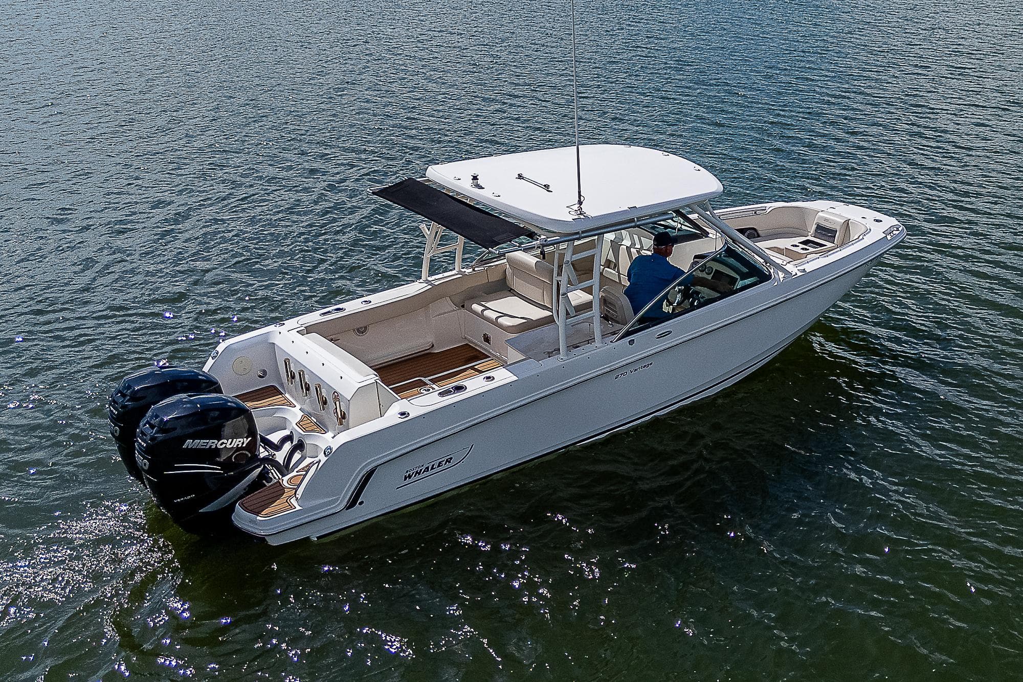 2018 Boston Whaler 270 Vantage boat on water, featuring dual Mercury engines.
