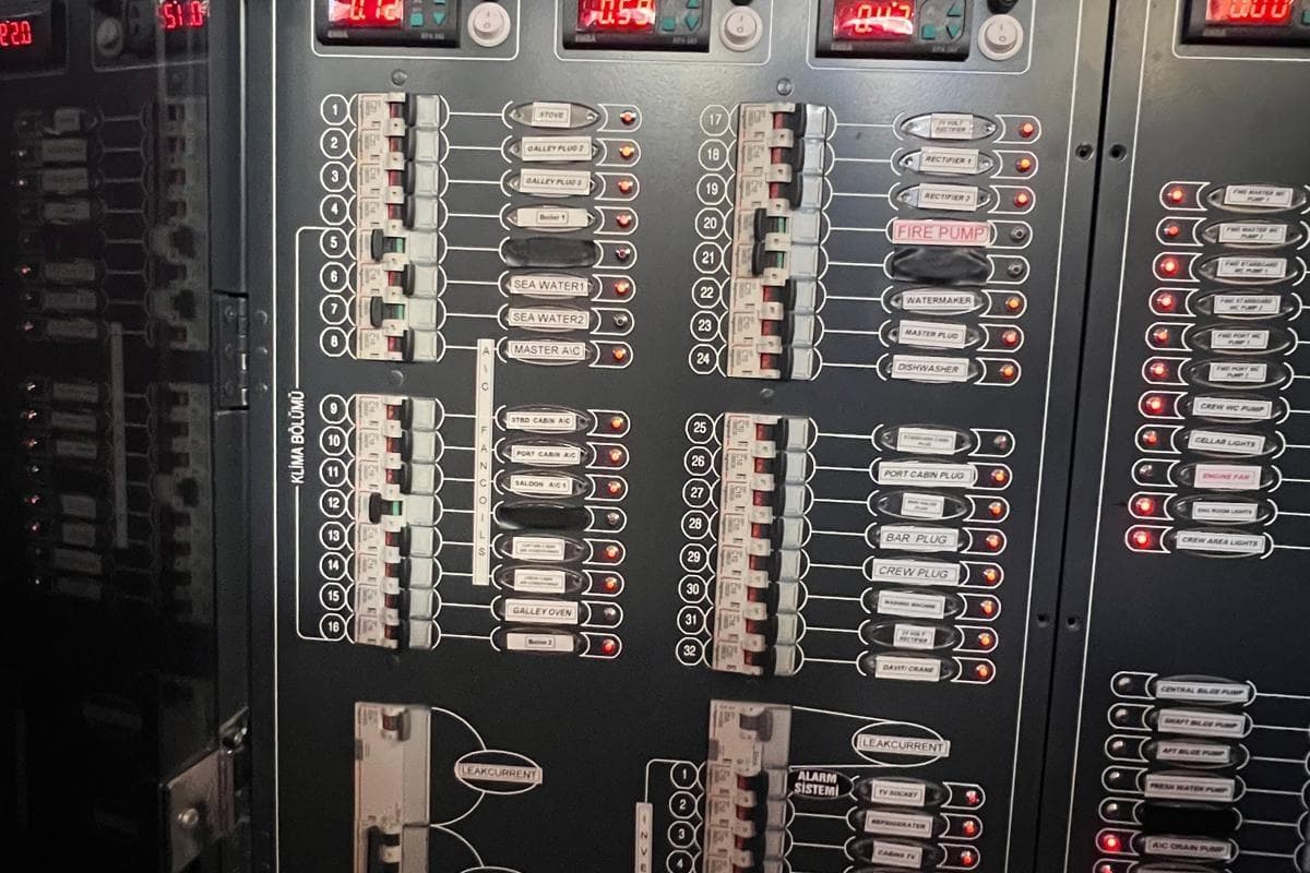 Control panel of the 1993 Custom Sailing Yacht Ocean Pure, featuring labeled switches and indicators.