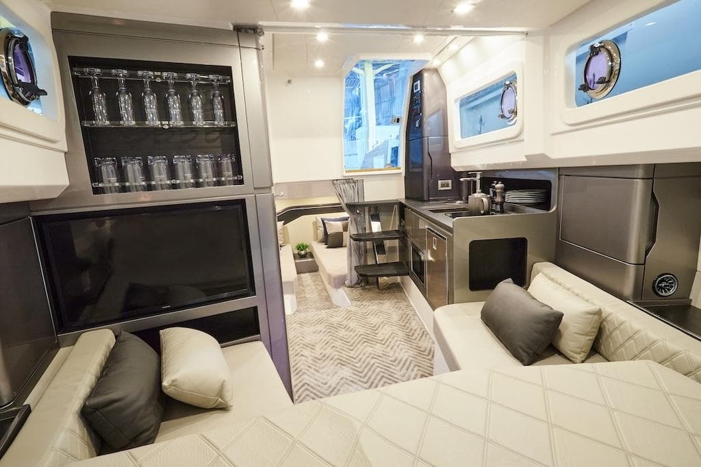 Luxurious interior of 2027 Schaefer V44 yacht with modern kitchen.