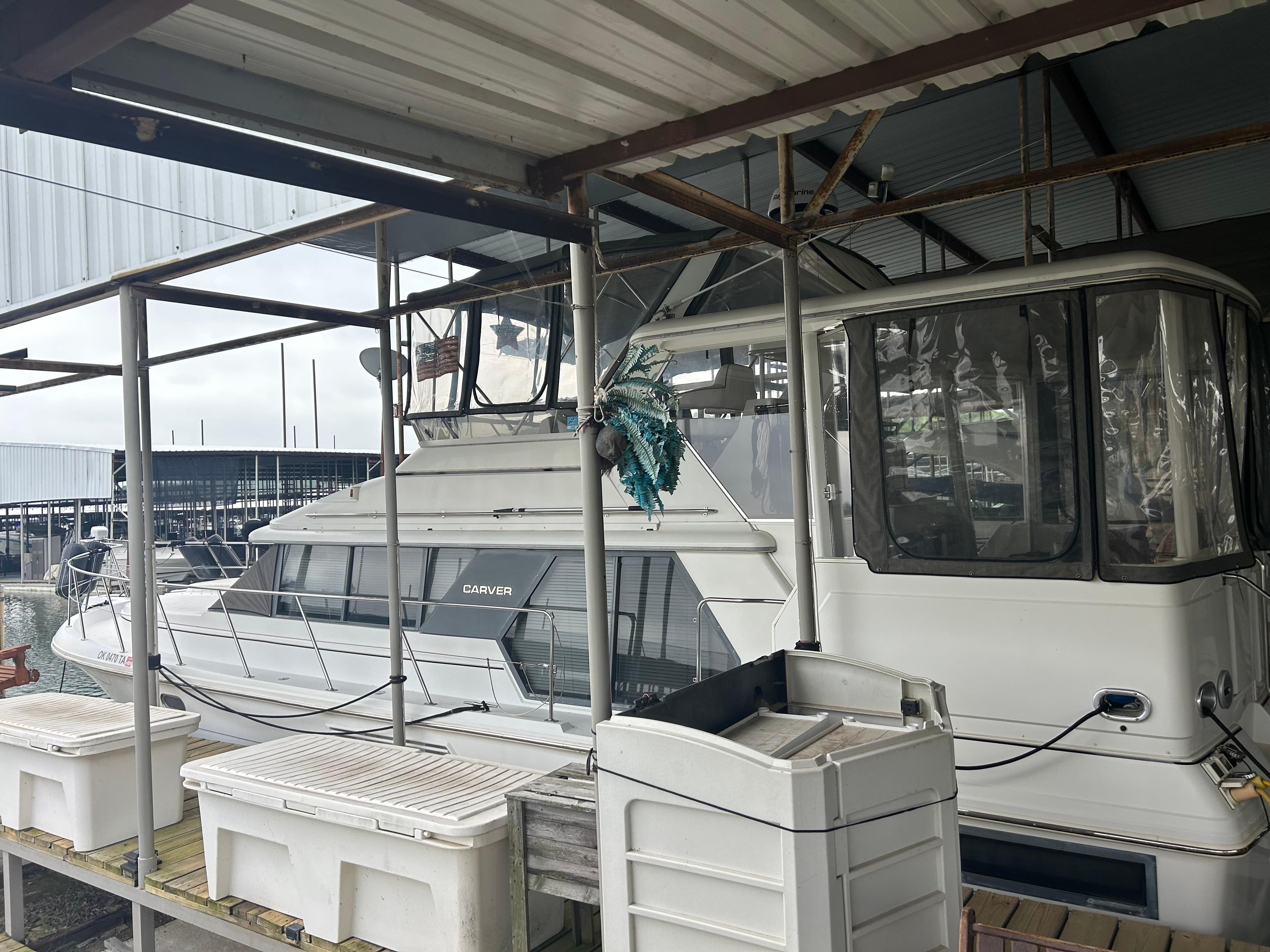 1996 Carver 440 Aft Cabin Motor Yacht docked in a marina.