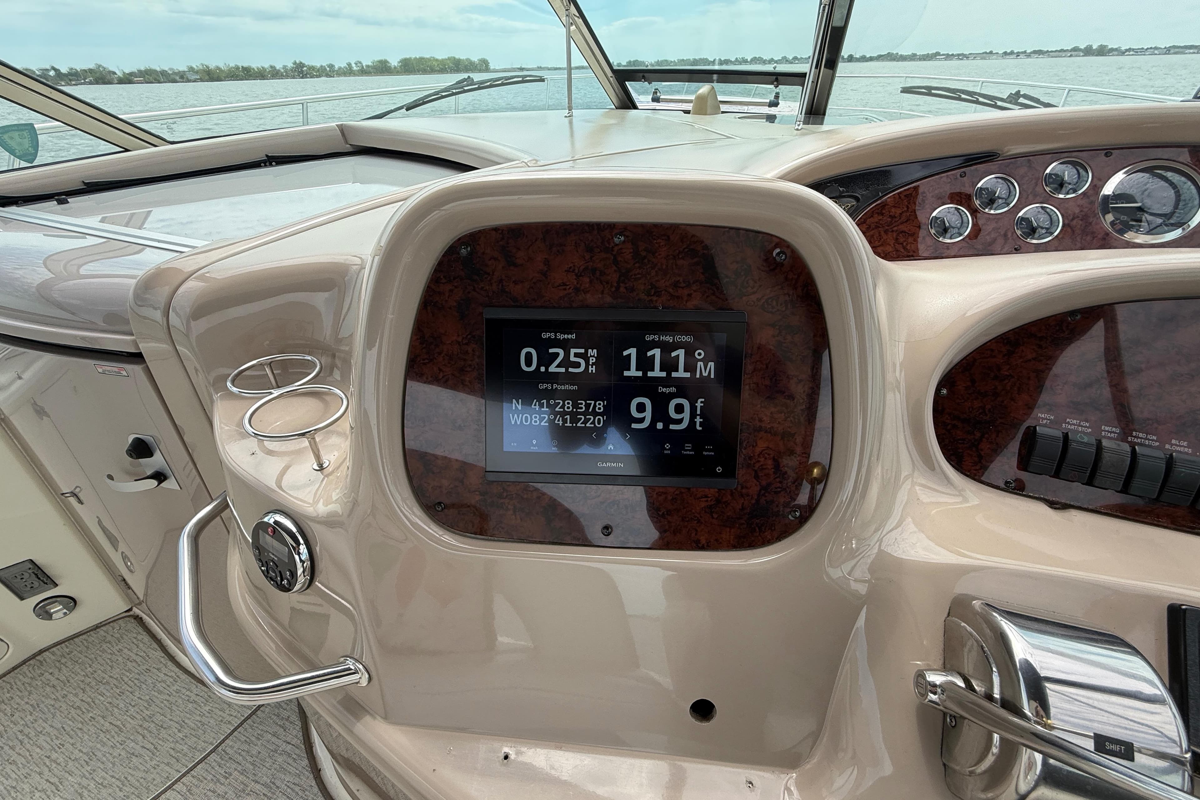 Dashboard of a 2000 Sea Ray 410 Sundancer boat with navigation display.