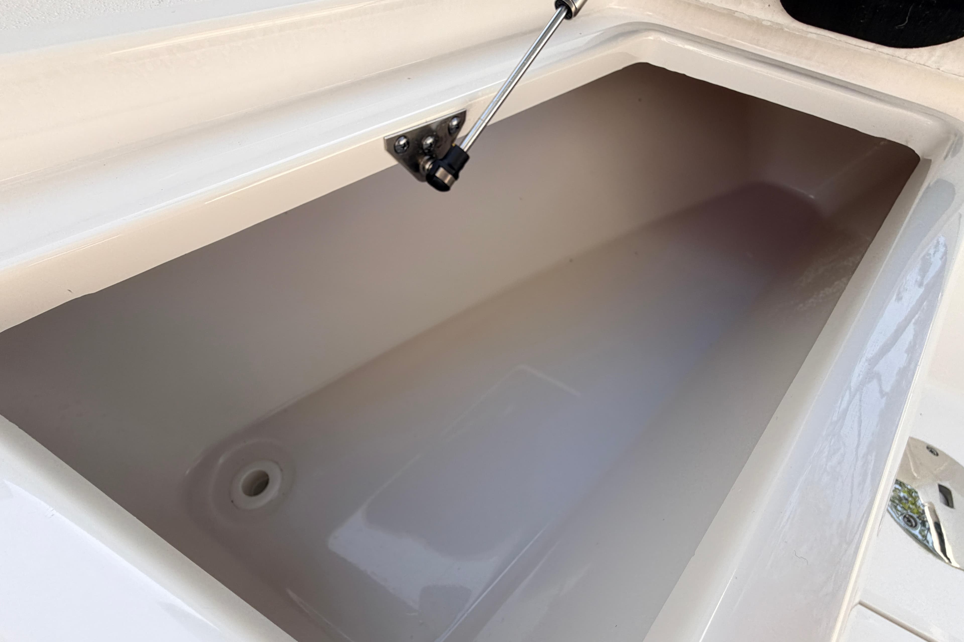 Storage compartment of 2022 Sea Fox 228 Commander boat, featuring a hydraulic lift.