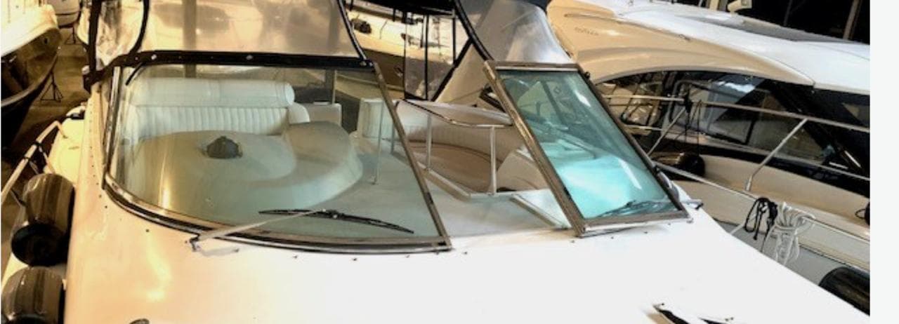 2002 Cruisers Yachts 3870 Express, luxury white yacht docked in marina.