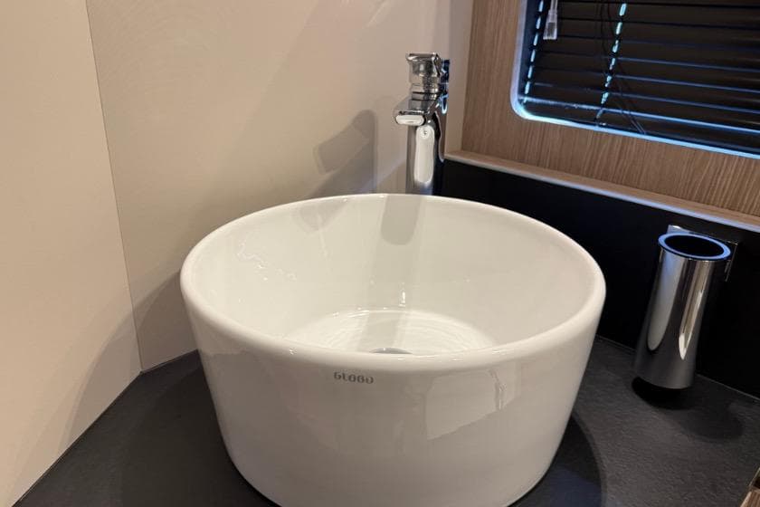 Modern round sink in 2023 Azimut Atlantis 45 yacht bathroom.