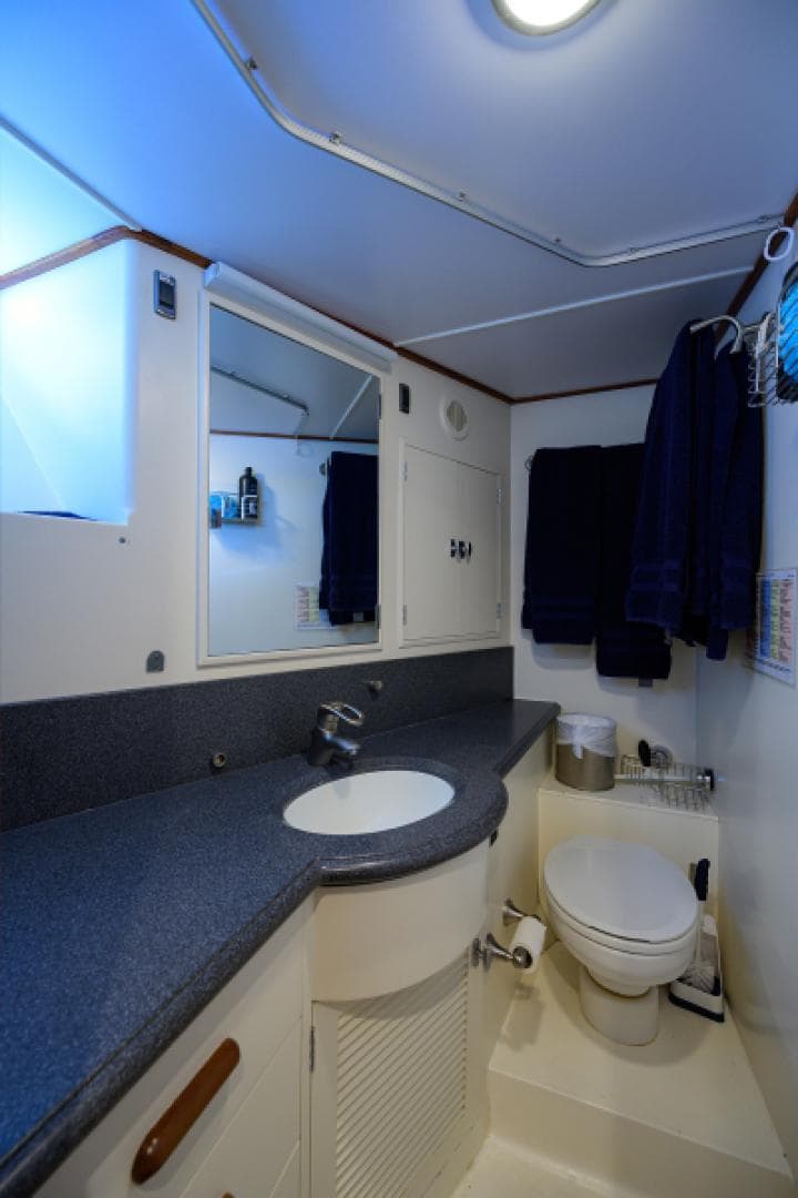 Bathroom interior of 2003 New England Boatworks Enclosed Raised Pilothouse yacht.