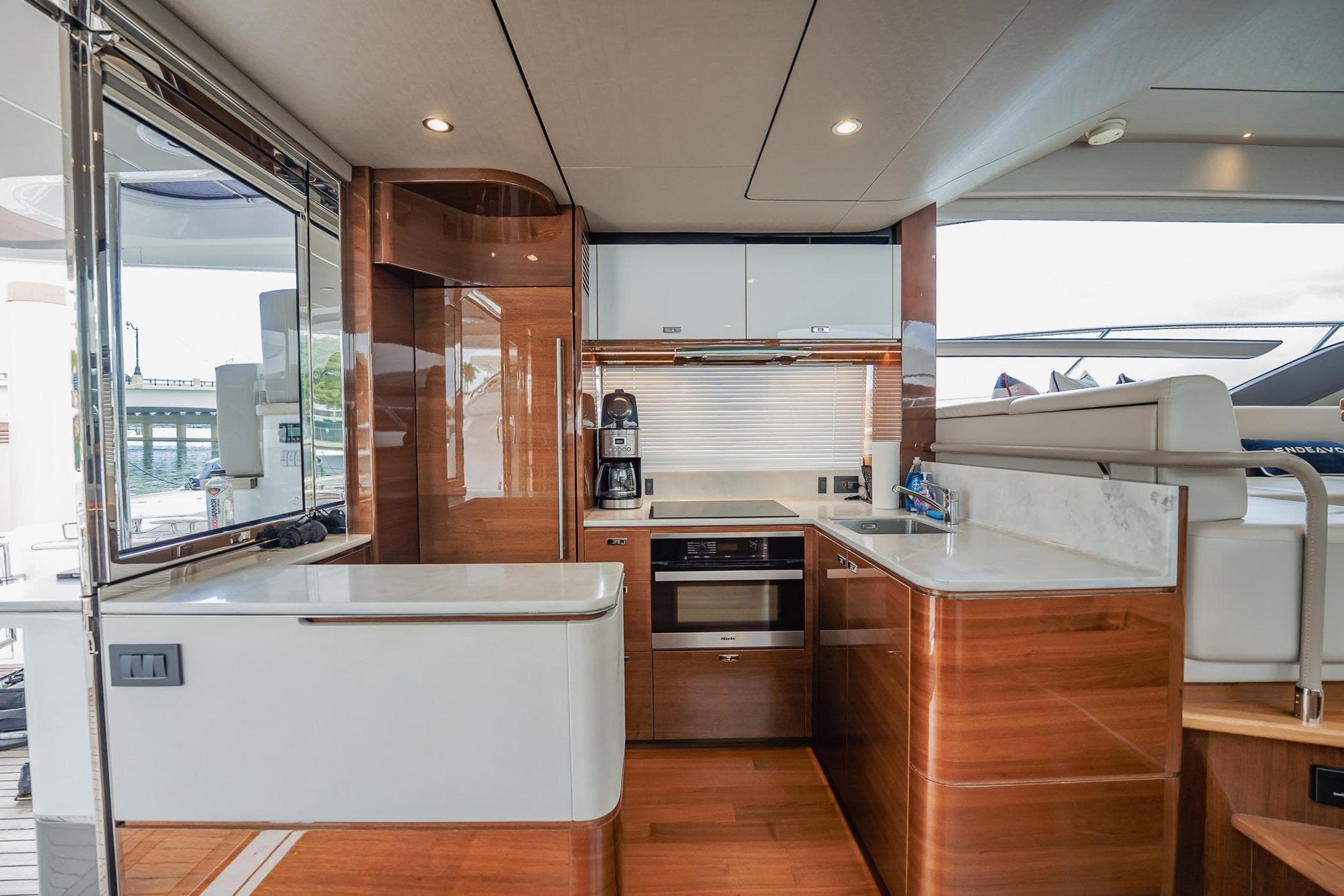 Luxurious 2019 Princess F55 yacht kitchen with modern appliances and sleek wood finishes.