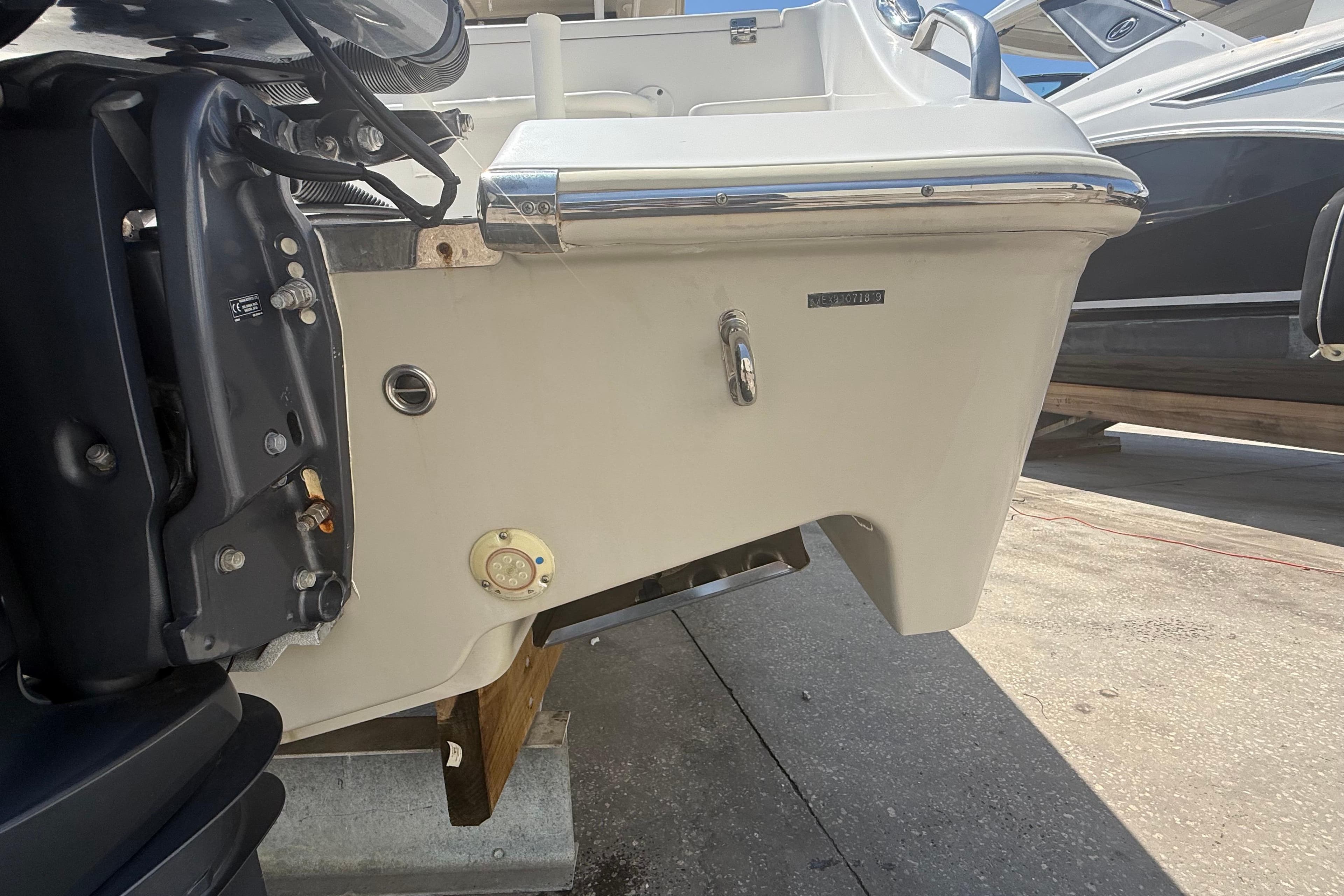 2019 Key West Billistic 281 Center Console boat stern view with motor details.