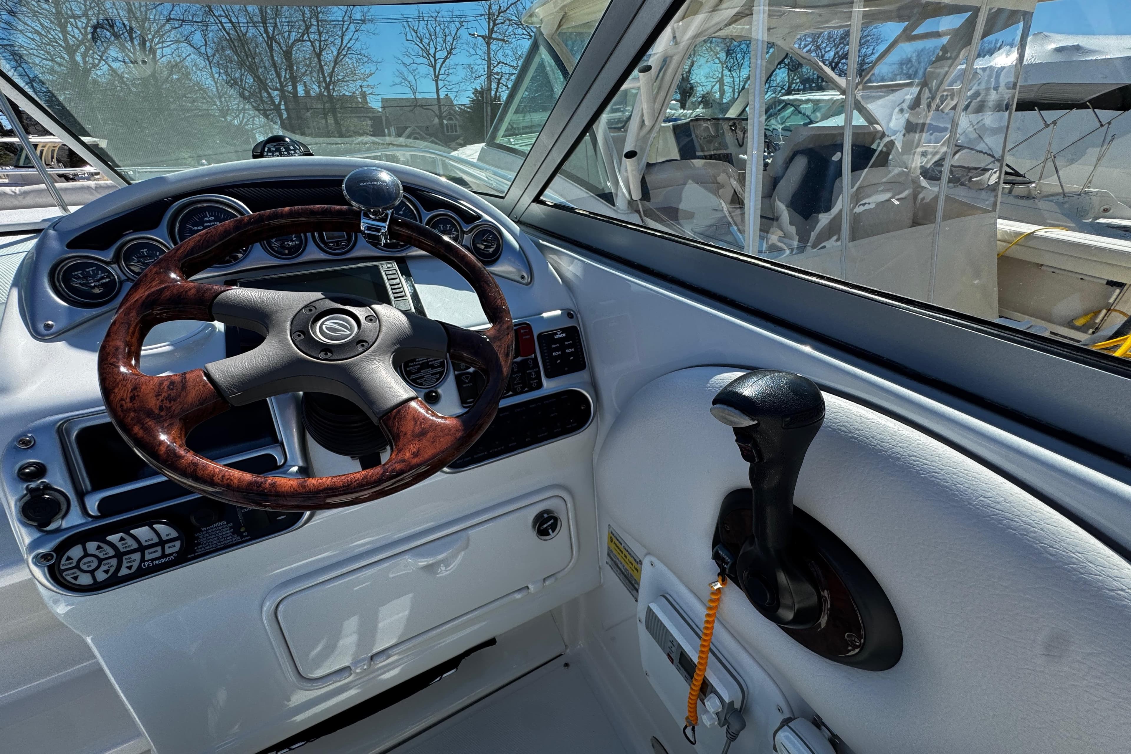 2004 Crownline 250 CR boat dashboard with steering wheel and controls.