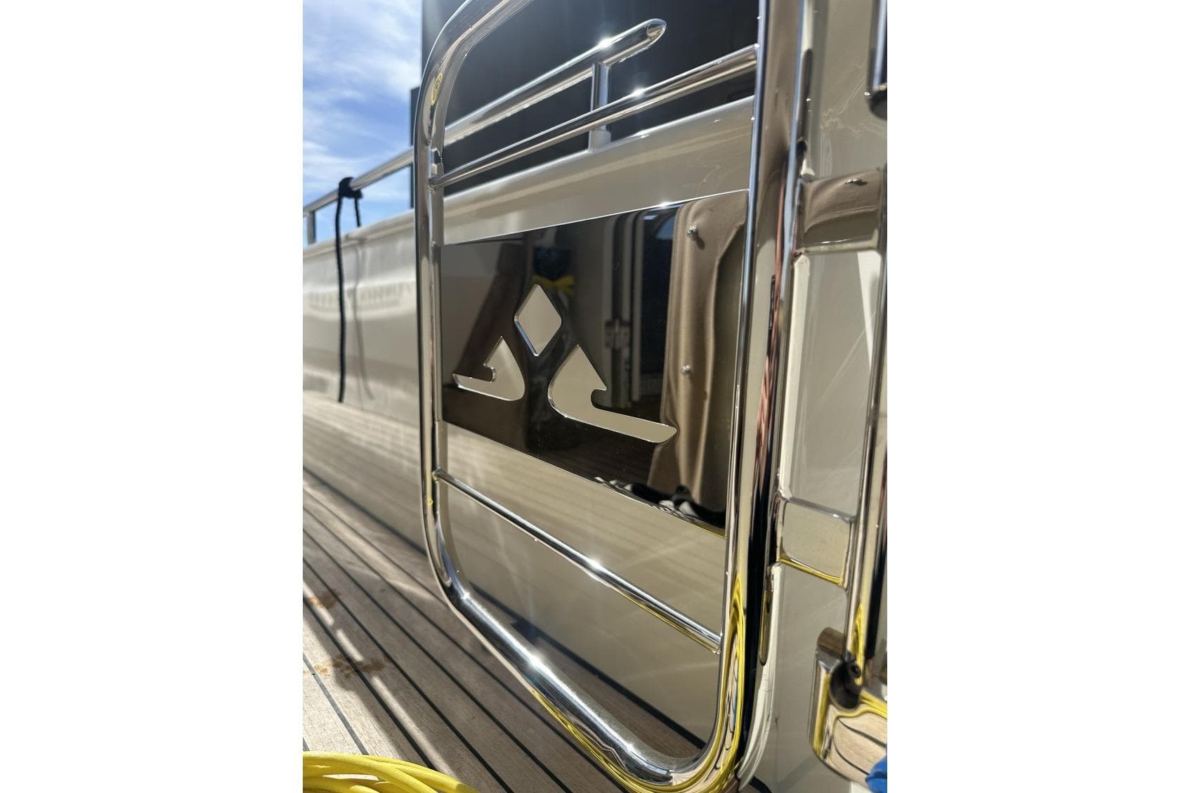 Close-up of 2026 Linssen Grand Sturdy 550 Variotop yacht's sleek chrome detailing.