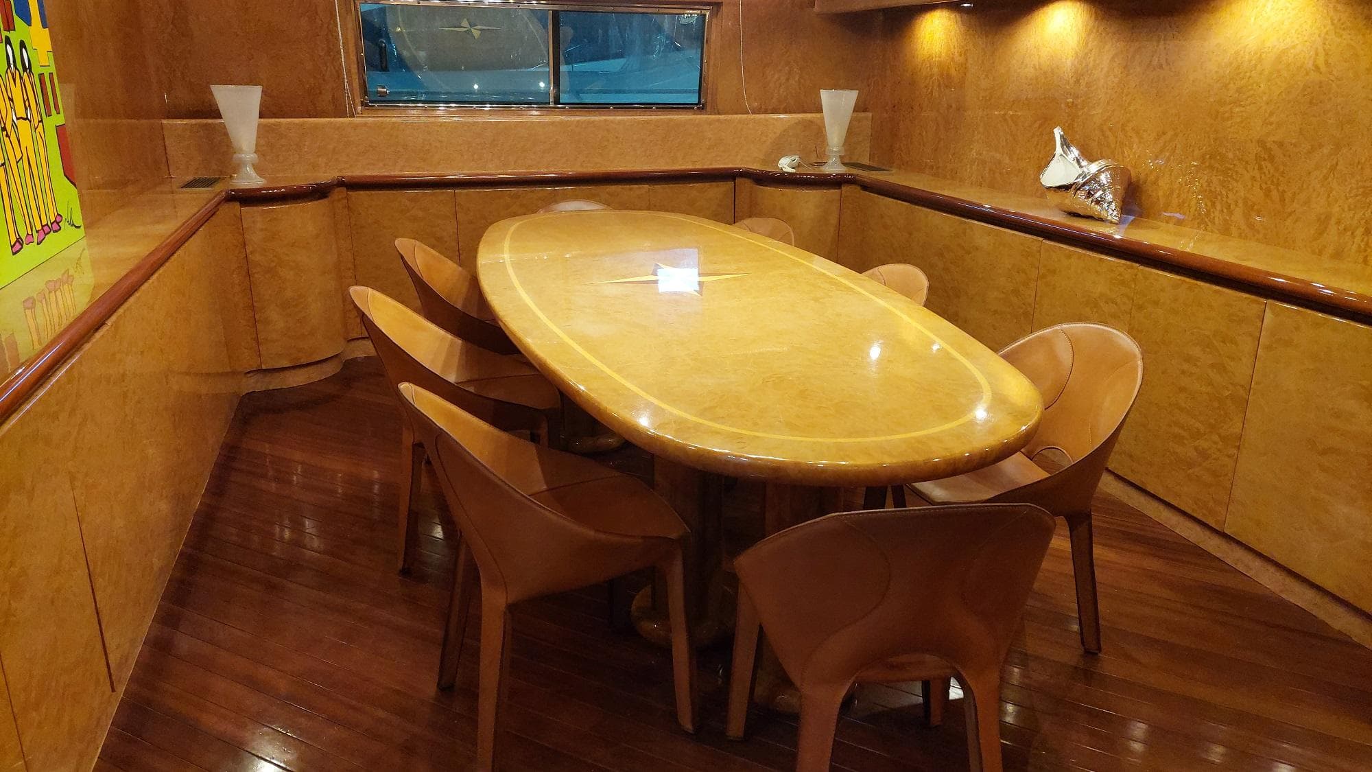 Luxurious wooden dining area on a 1992 Admiral 28 yacht.