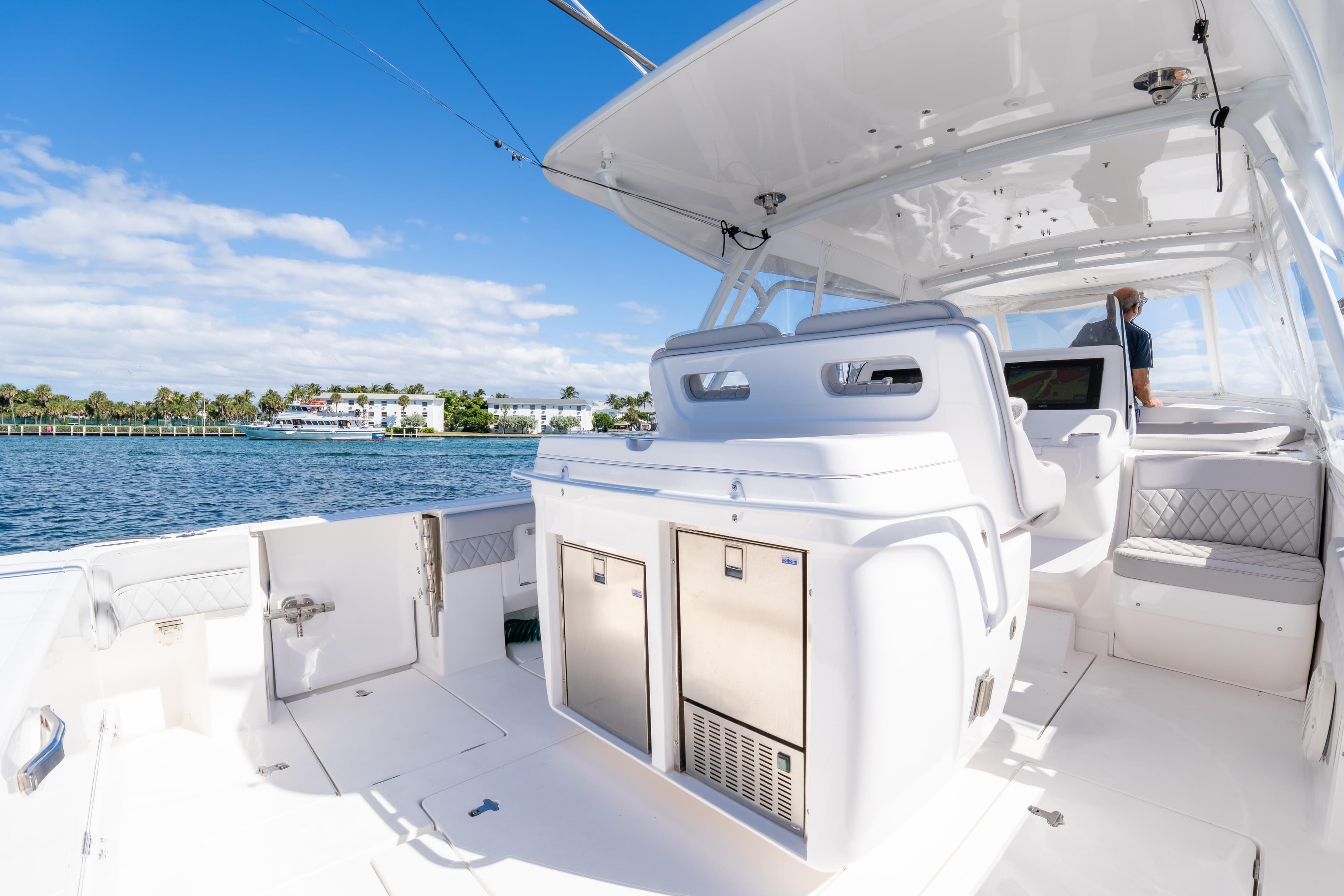 2019 Intrepid 407 Cuddy boat interior with seating and ocean view.