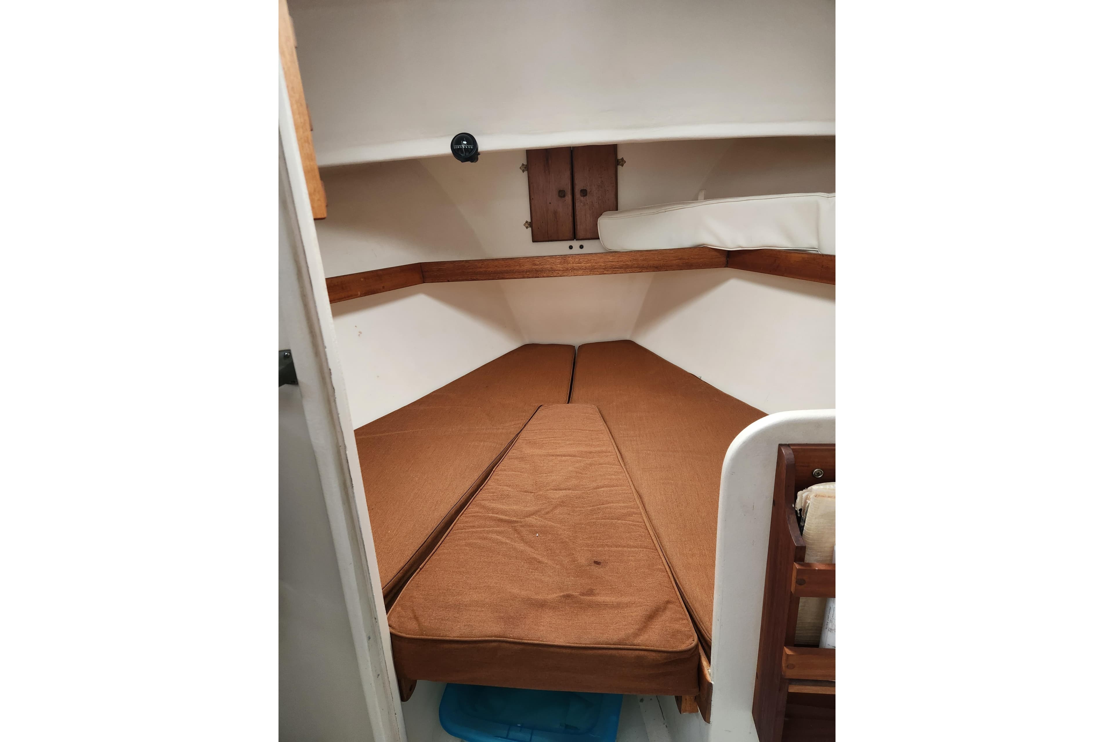 1988 Duffy 31 Lobster Boat cabin interior with brown cushions and wooden accents.