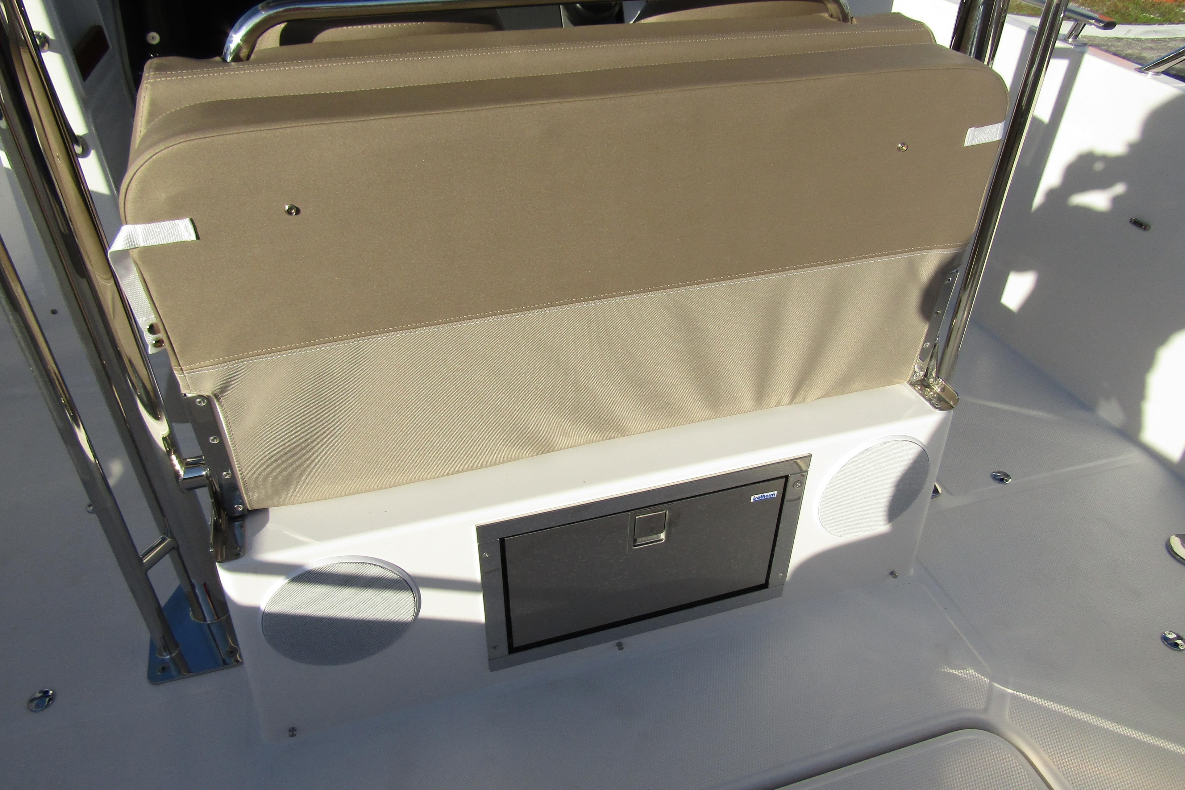 Nimbus Tender 9 (2025) boat interior with beige seating and storage compartment.