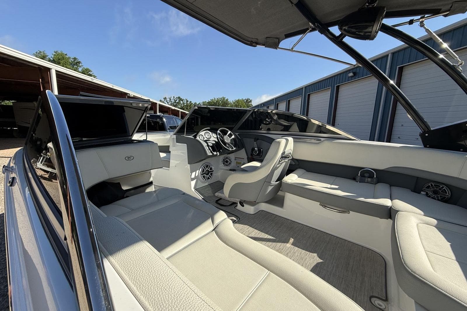 Interior of a 2022 Cobalt 220S boat, featuring sleek seating and modern dashboard.