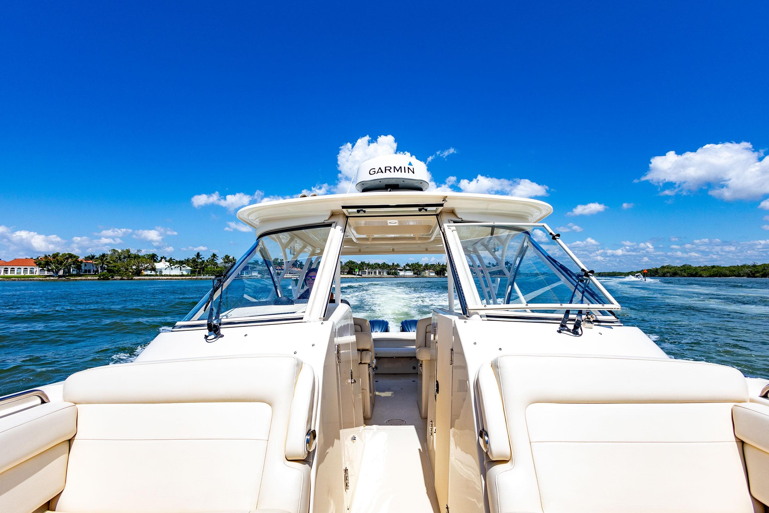 2018 Grady-White Freedom 335 boat cruising on a sunny day.