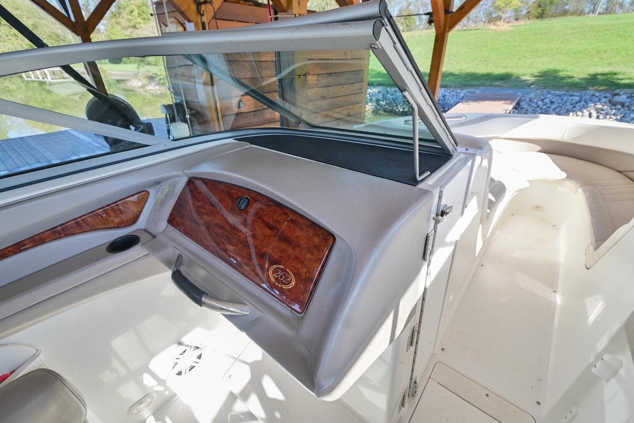 Interior view of a 2002 Cobalt 262 boat, featuring sleek design and wood accents.