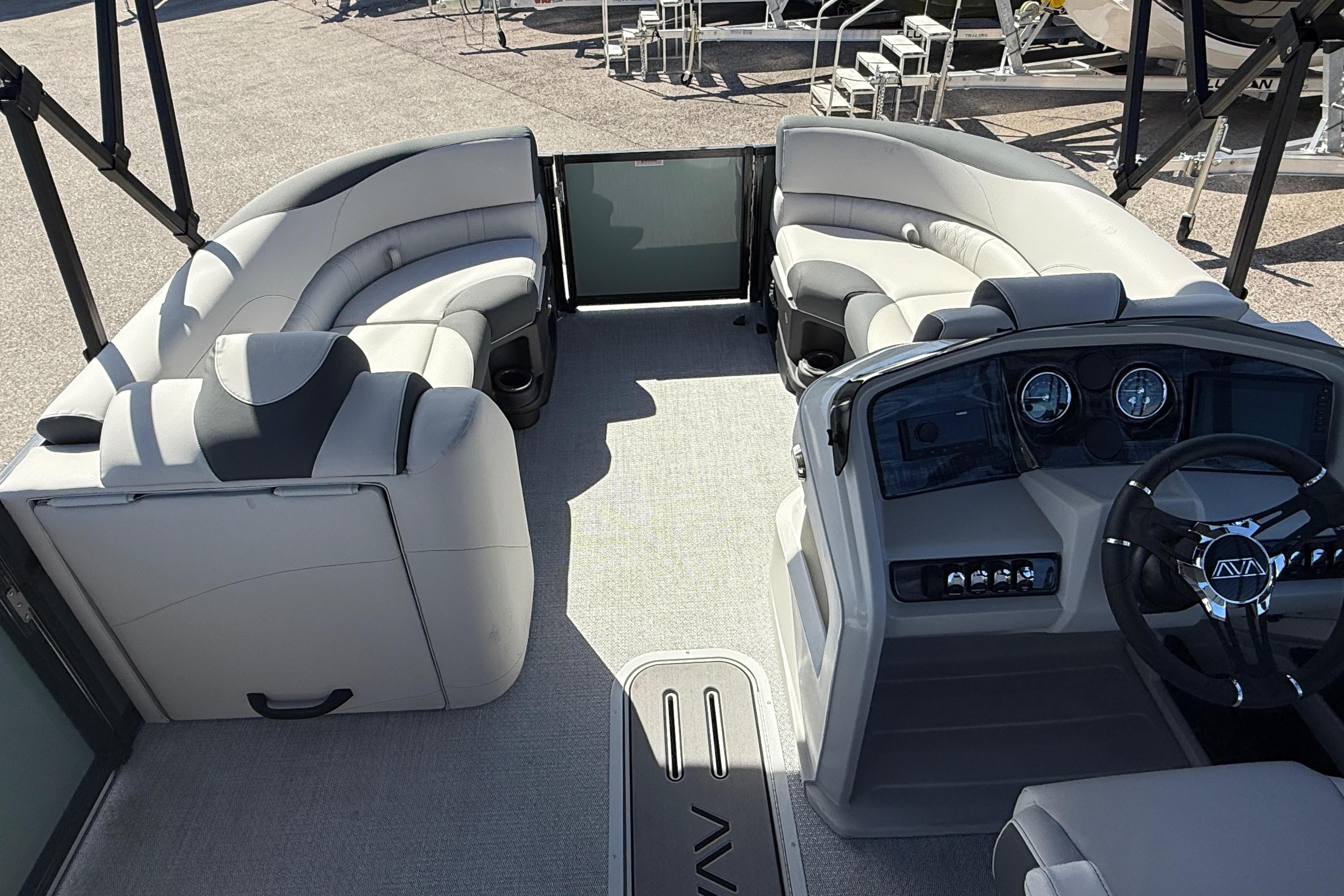 2026 Avalon 2385 LSZ Quad Lounger Tri Toon interior with plush seating and modern dashboard.