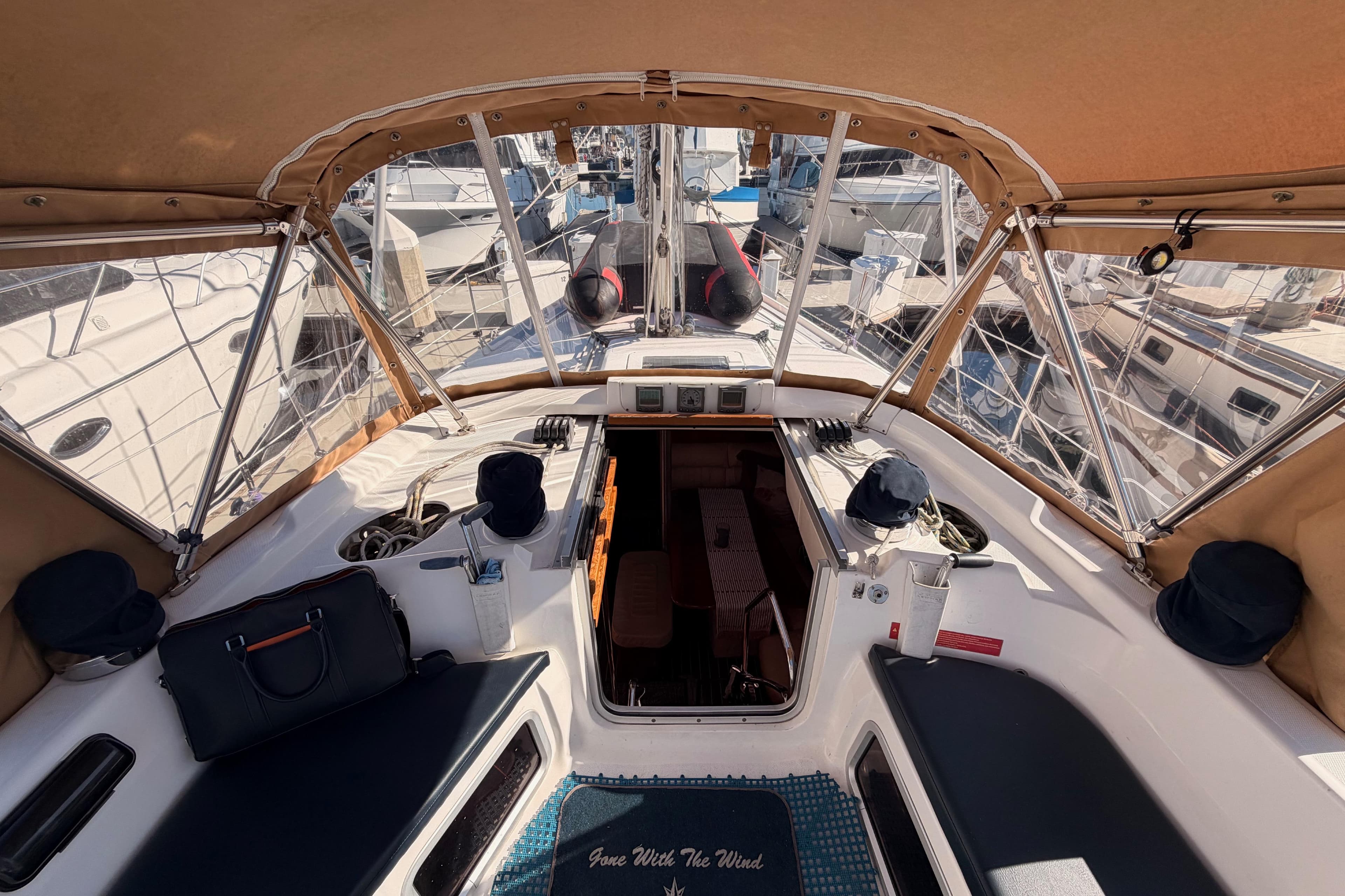 Interior view of a 2005 Hunter Passage 456 sailboat cockpit with seating and navigation equipment.