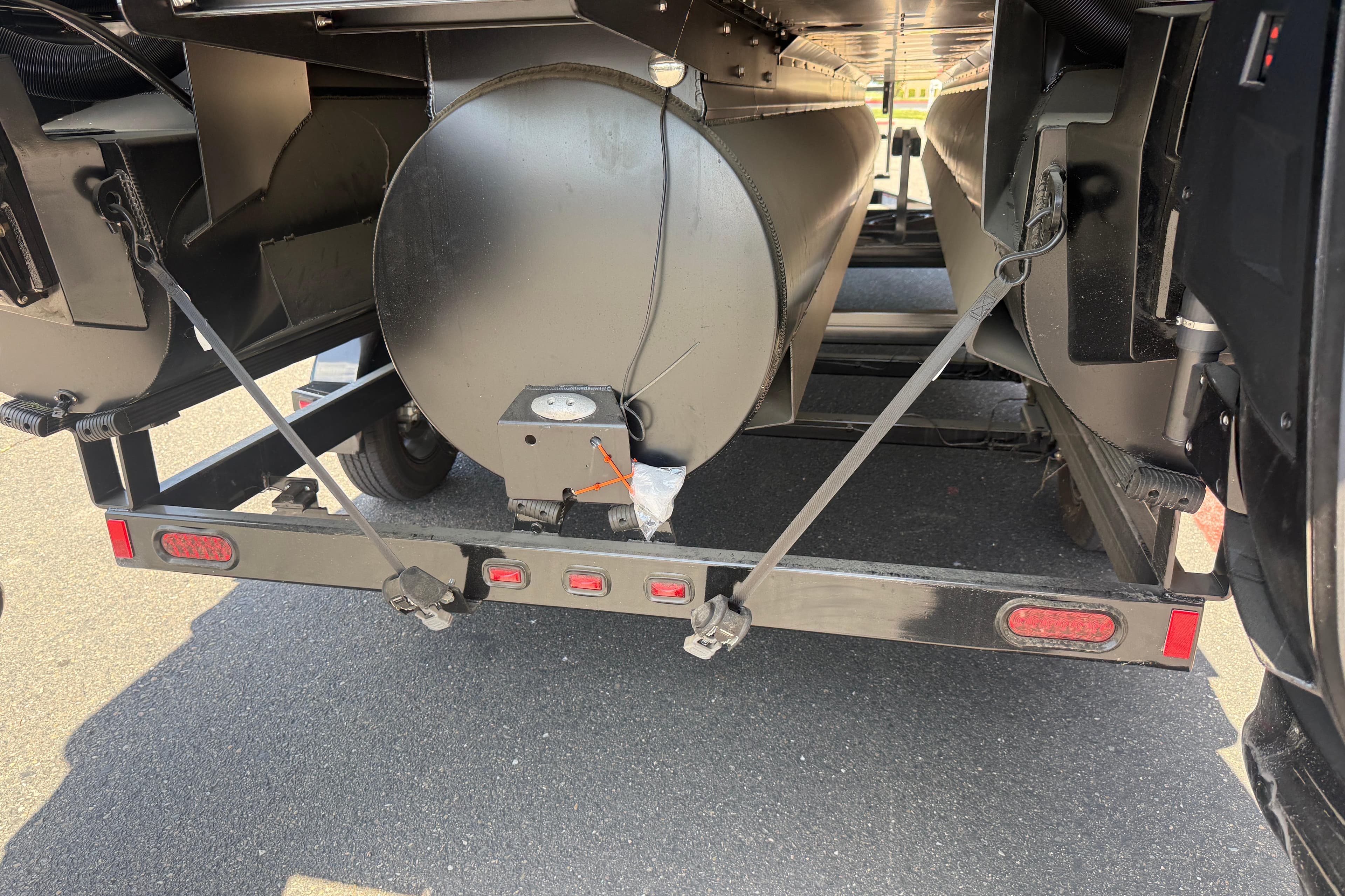 2025 Manitou Explore Dual Engine trailer hitch and rear view on asphalt.