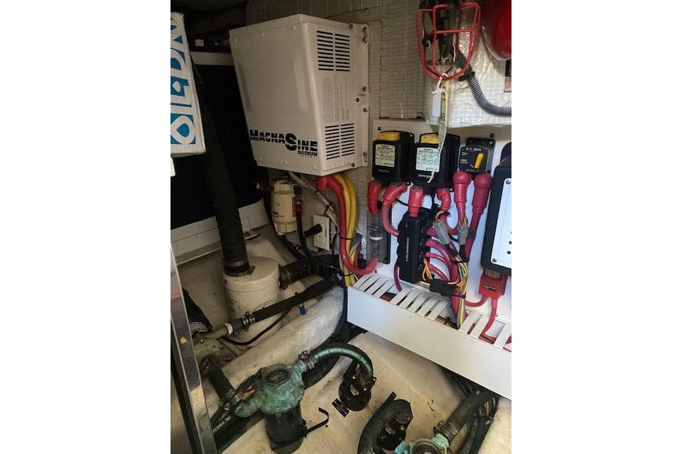 Engine room of 2010 Sabre 40 Sedan with electrical components and wiring.