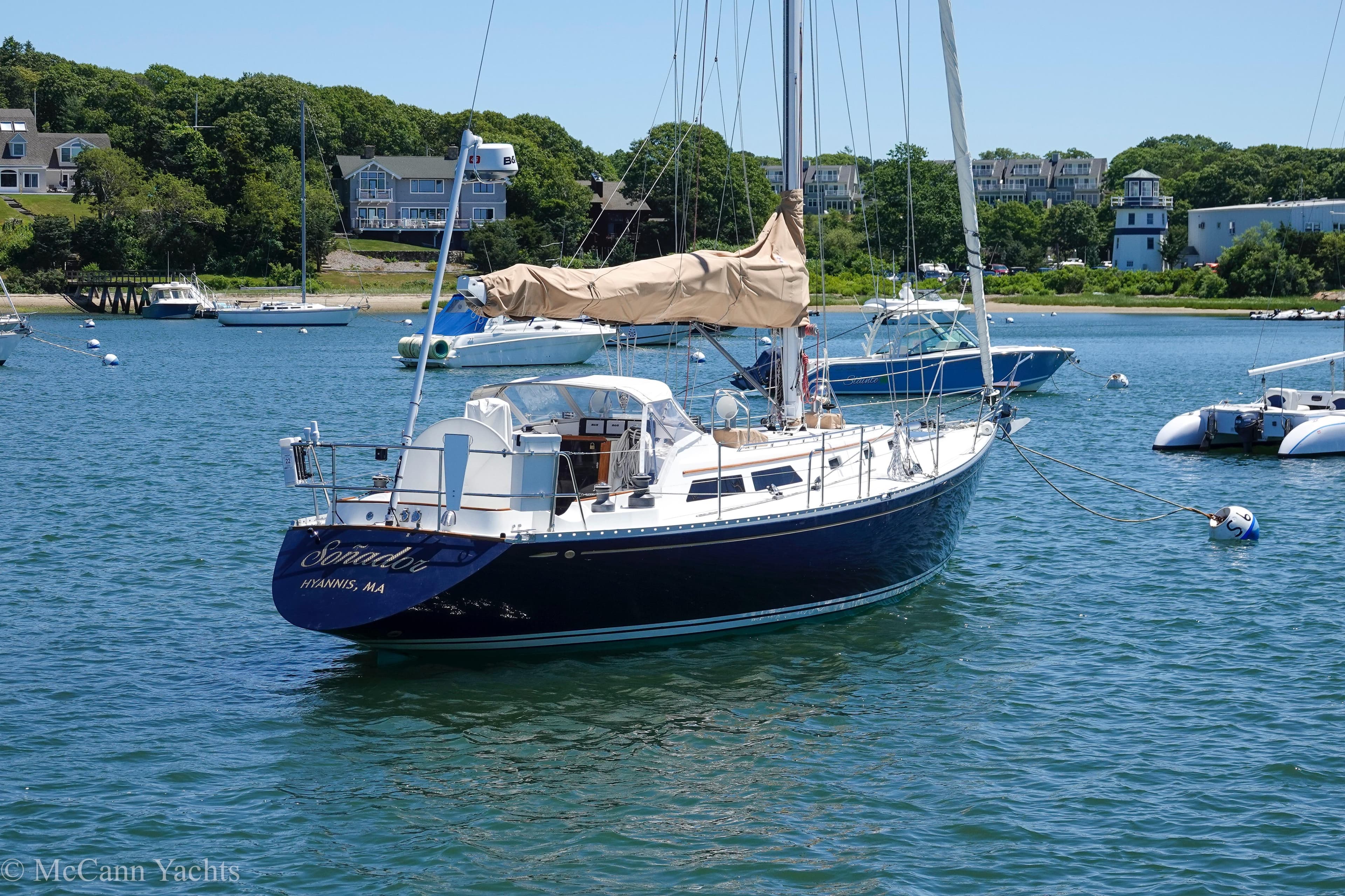Sailboat Alden 43 Aft Cockpit, 1993 model, moored in a scenic harbor.