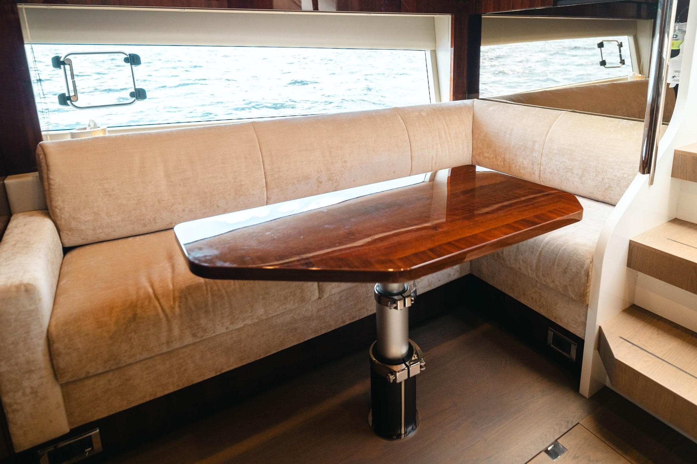 Luxurious interior of 2020 Fairline Targa 45 Open yacht with elegant seating and wooden table.