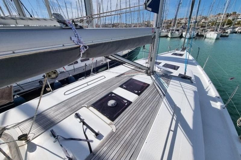 2012 Hanse 445 sailboat deck with marina view, featuring sleek design and modern fittings.