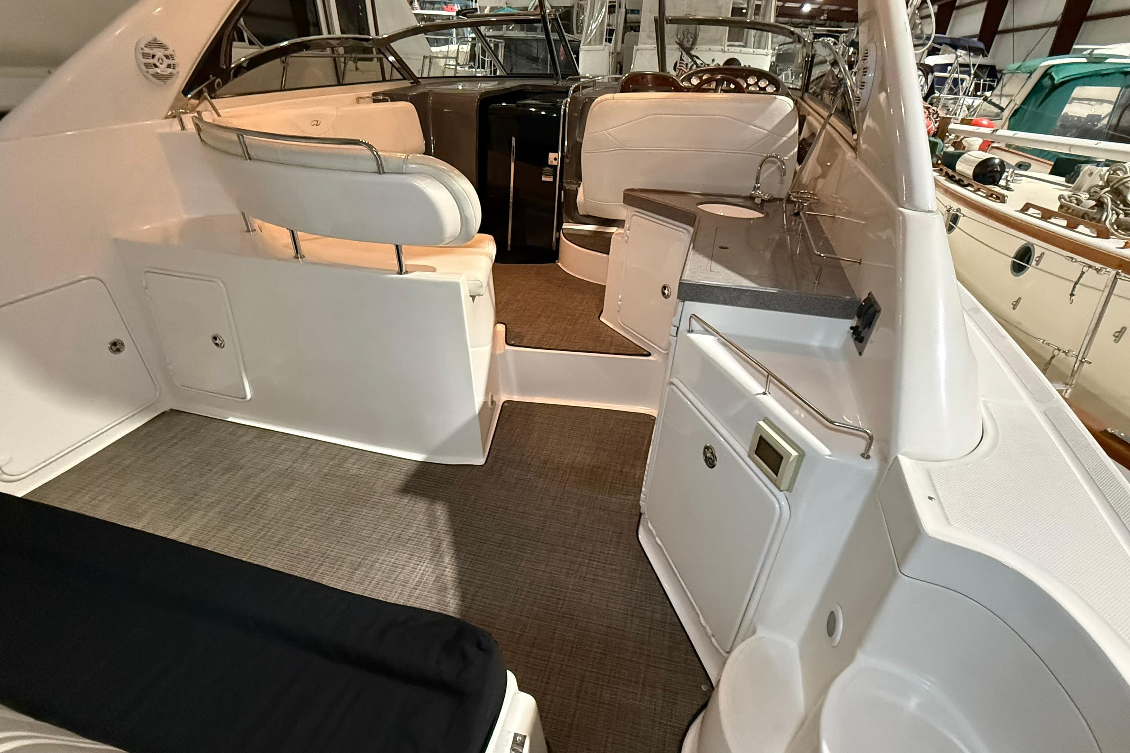 2007 Regal Commodore 3760 IO boat interior with seating and kitchenette.