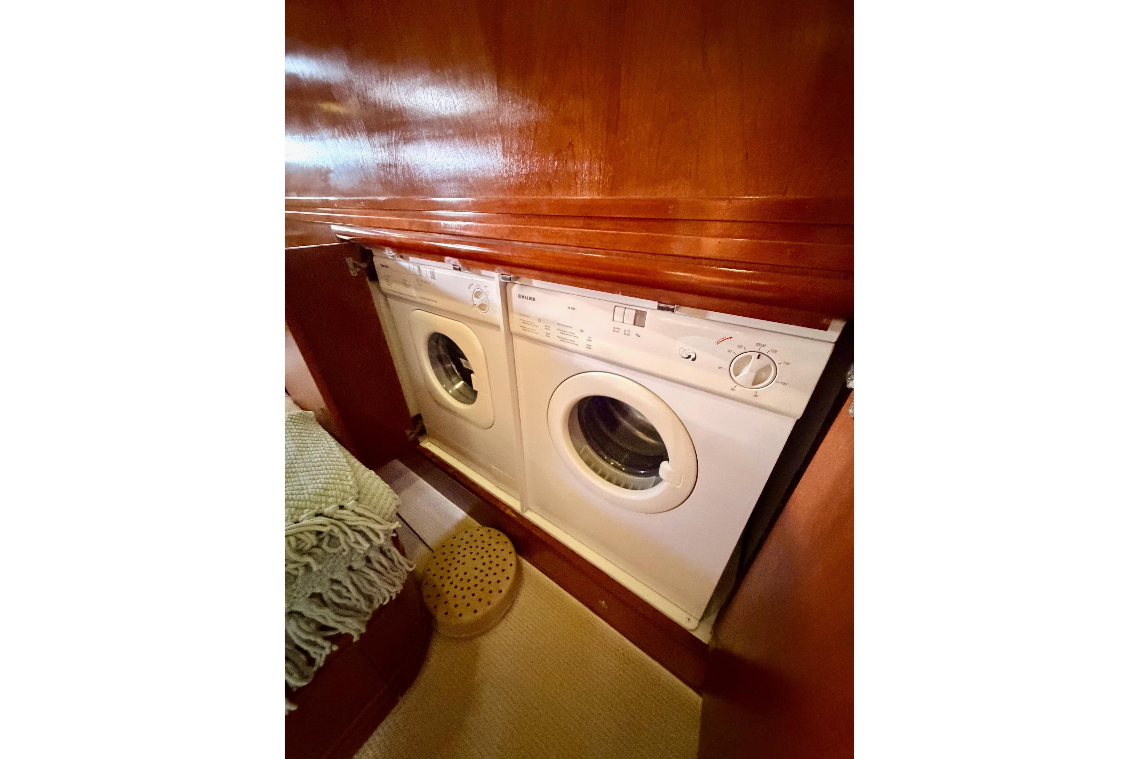 Laundry appliances in 1999 Carver 530 Voyager Pilothouse yacht interior.