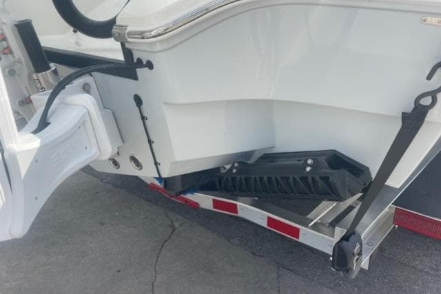 2026 Pathfinder 2600 TRS boat on trailer, rear view showing hull and support structure.