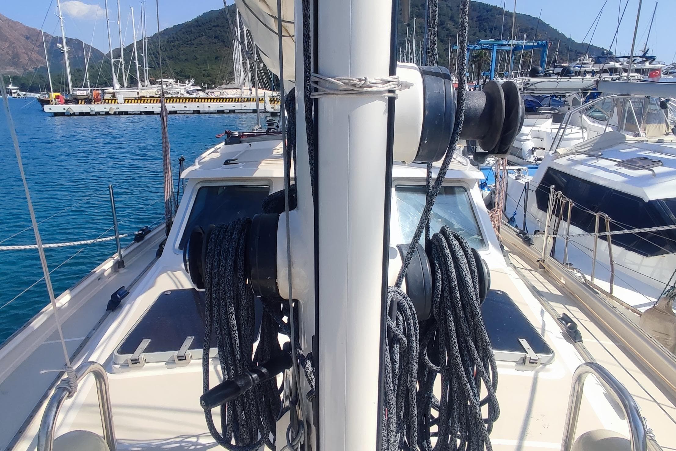 Sailboat deck view with ropes, Custom Danish 44, 1987, docked in marina.