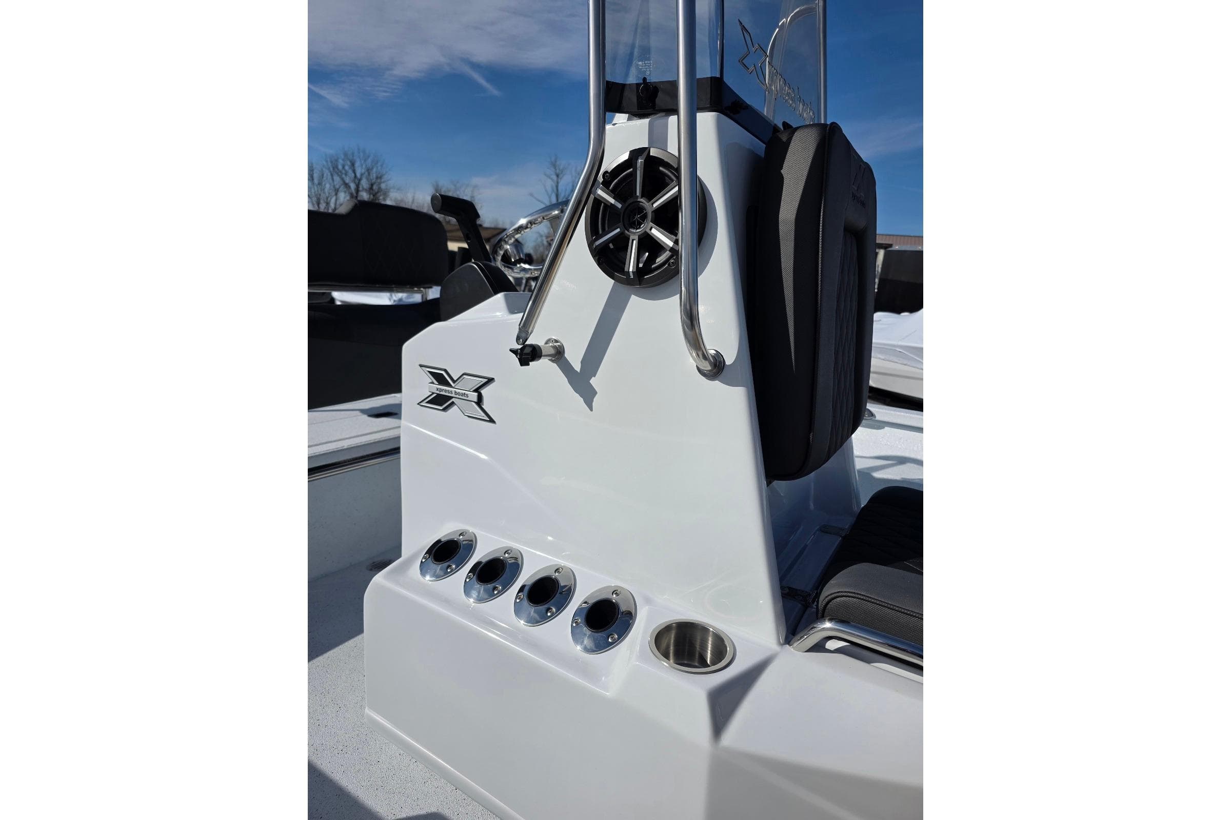 2026 Xpress H20B Bay boat console with steering wheel and cup holders.