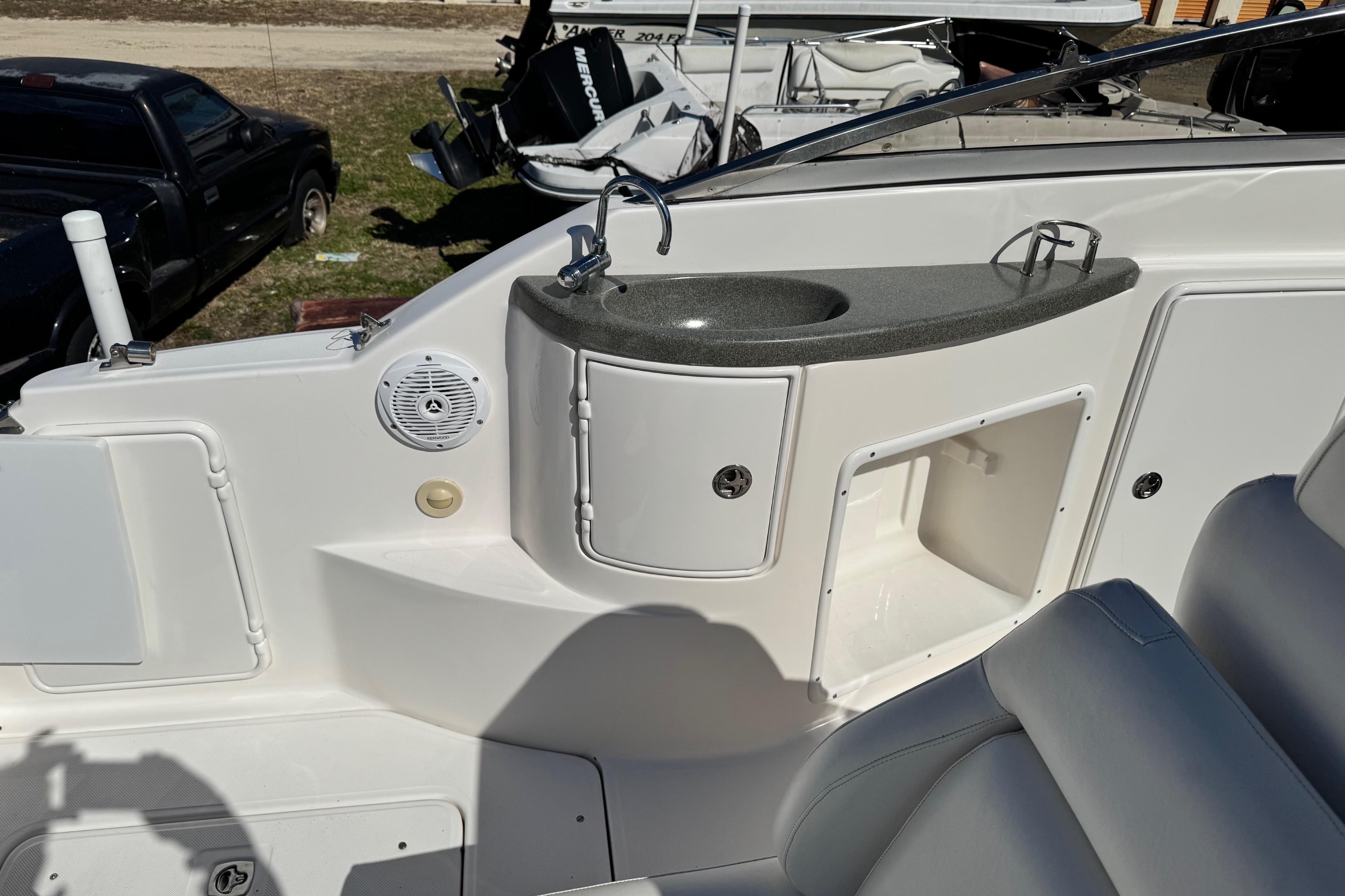 2007 Regal Commodore 2665 boat interior with sink and storage compartments.