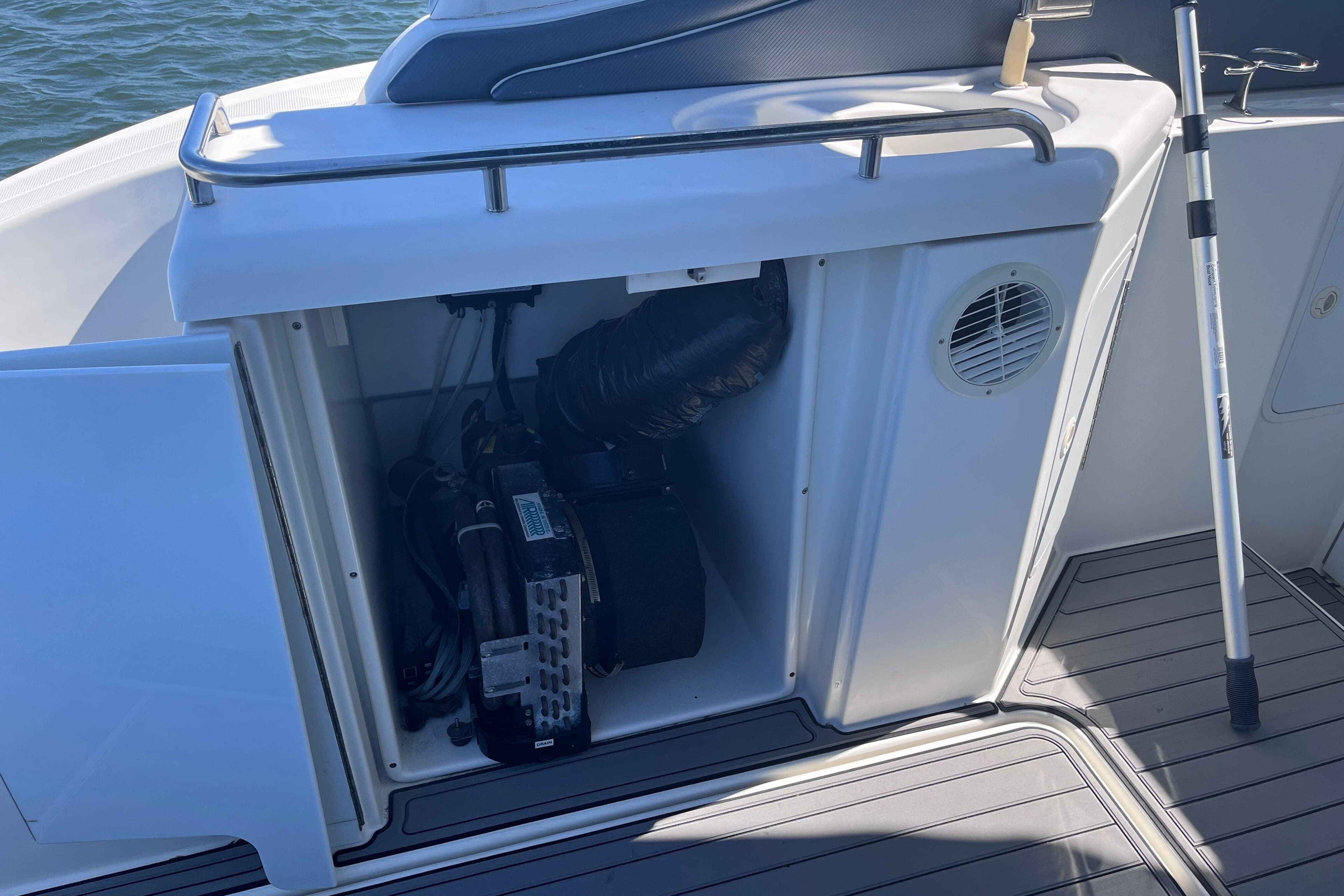 2007 Cruisers Yachts 370 Express engine compartment with open hatch, showing internal components.