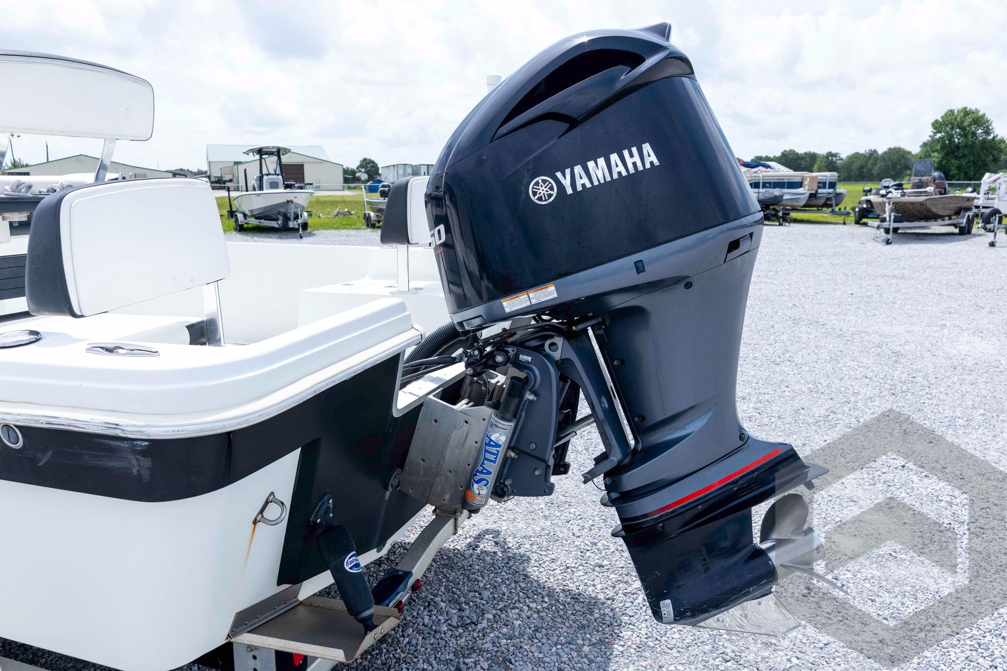 2018 Bay Rider 238 Bay boat with Yamaha outboard motor in a gravel lot.
