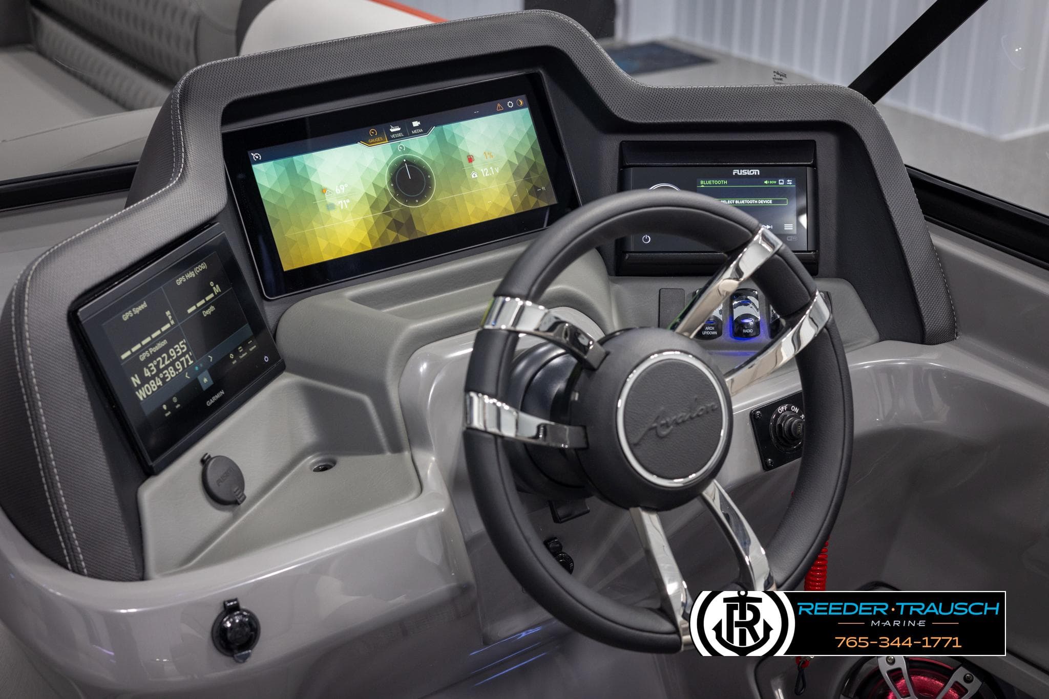 2024 Avalon 2785 Excalibur EL boat dashboard with advanced digital displays and steering wheel.
