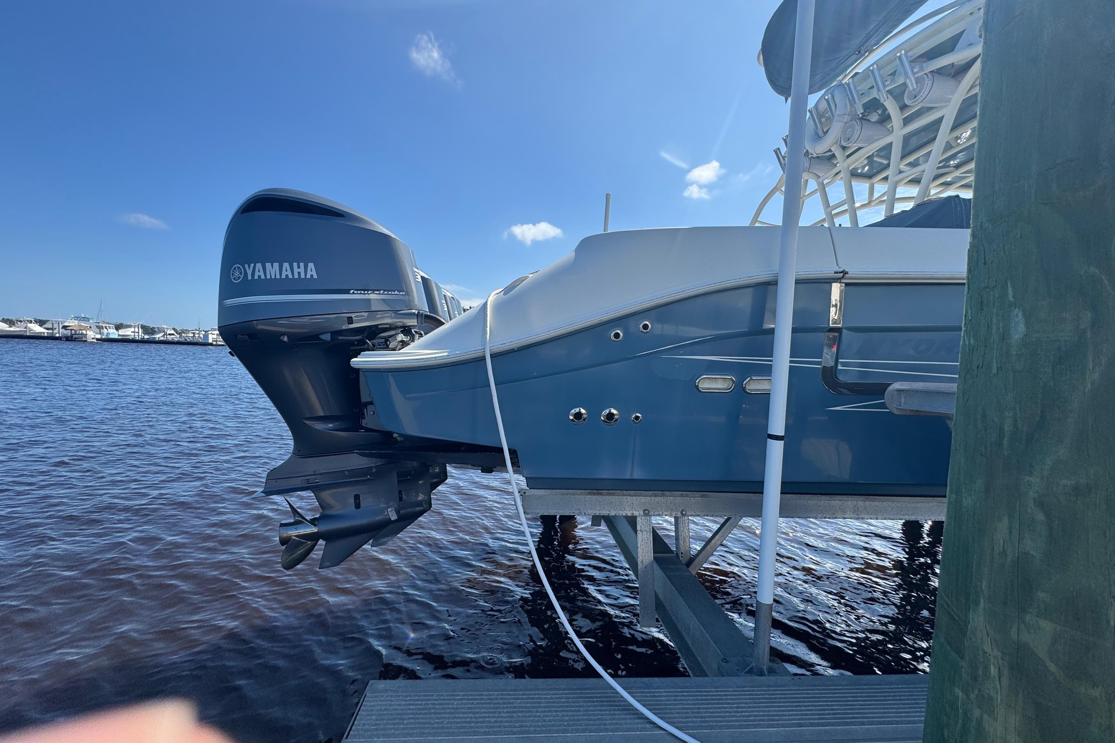 2012 Hydra-Sports 4200 Siesta boat with Yamaha engine docked by the water.