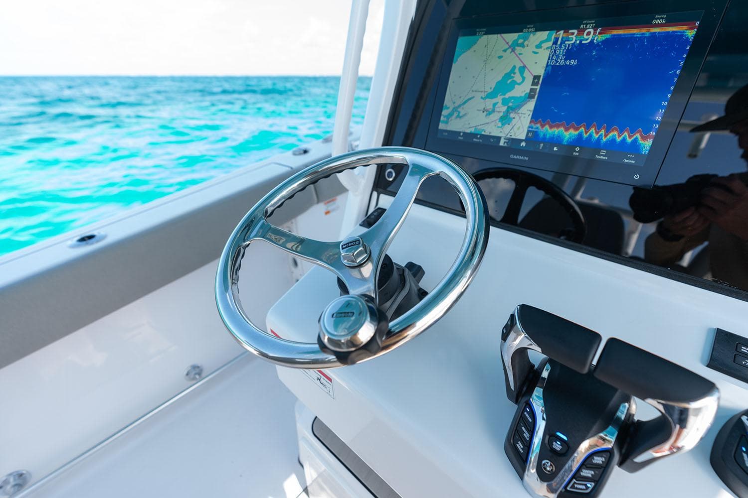 Manufacturer Provided Image: 2025 Sportsman Open 302 Center Console with advanced navigation system on open sea.