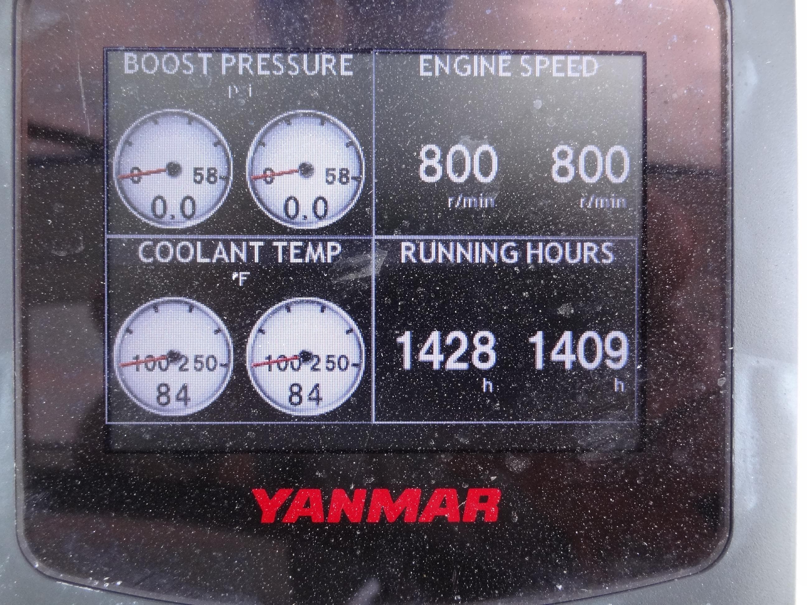 Yanmar engine display showing boost pressure, engine speed, coolant temperature, and running hours.