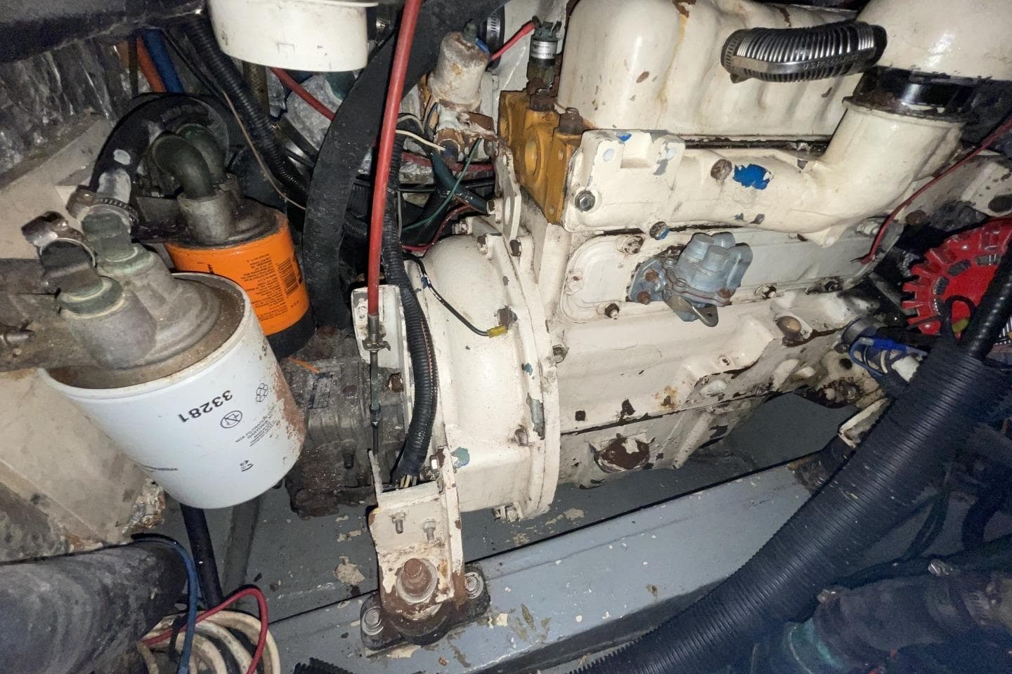 Engine compartment of a 1986 Gulfstar Hirsch 45 sailboat, showing mechanical components and wiring.