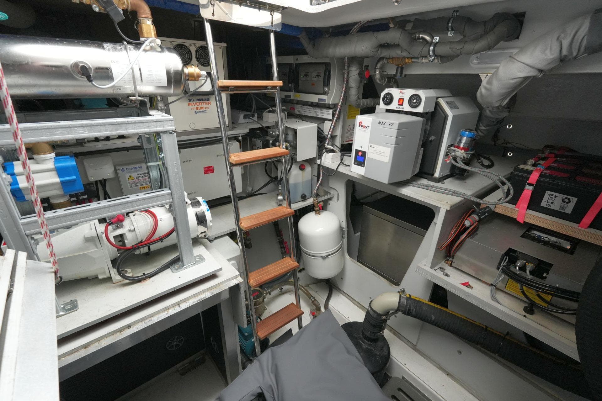 Engine room of 2022 Fountaine Pajot Alegria 67 yacht, featuring equipment and machinery.