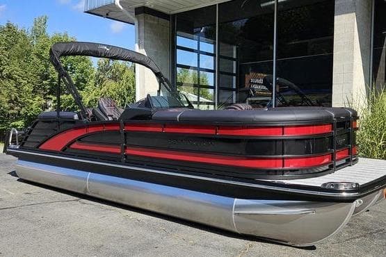 2026 Bennington 23 RFB pontoon boat with sleek black and red design.