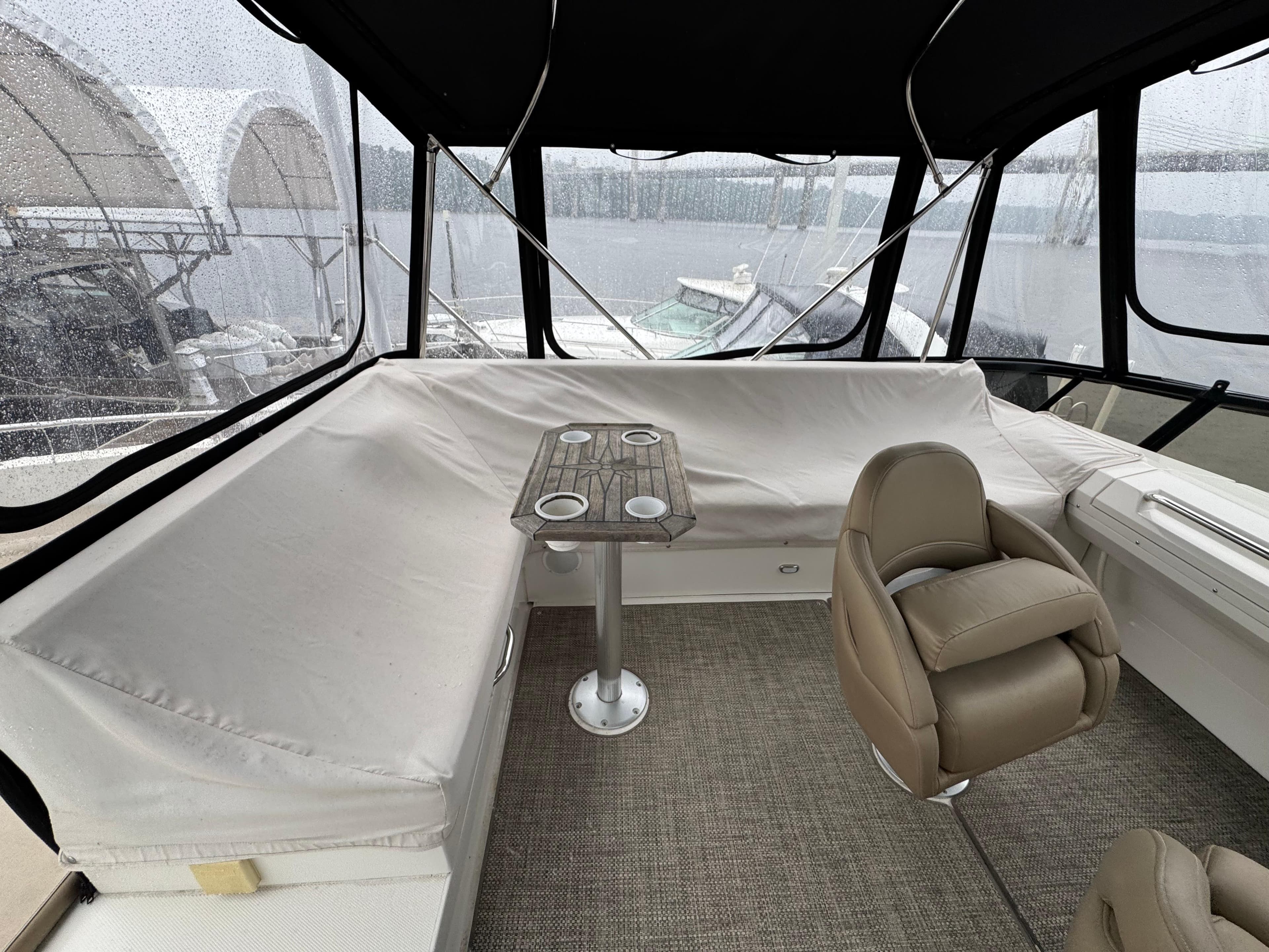 Interior of 2014 Carver C40 Command Bridge with seating and table.