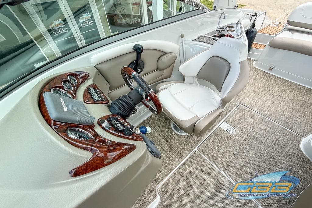 2015 Crownline Eclipse E6 boat cockpit with steering wheel, controls, and comfortable seating.