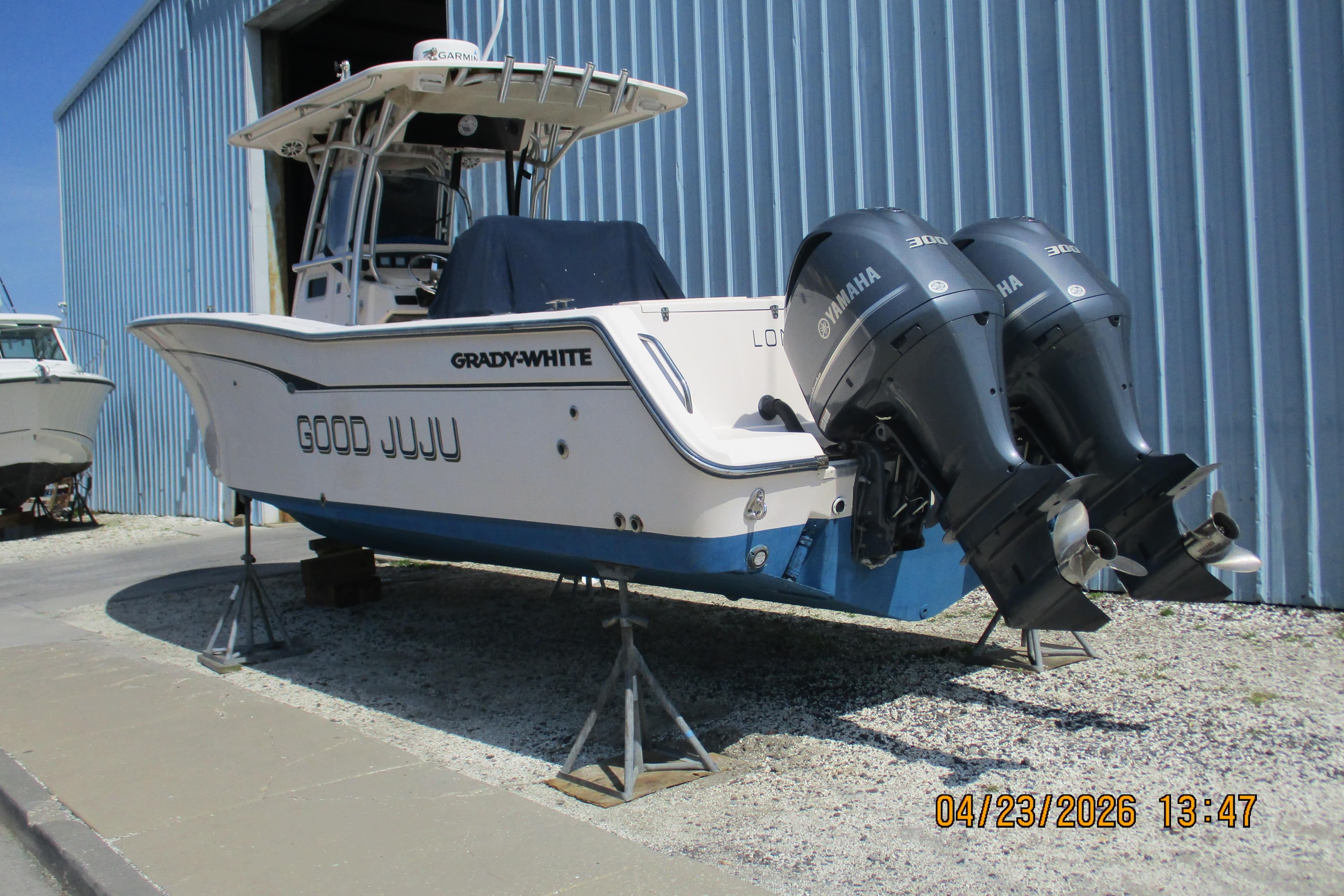 2007 Grady-White Bimini 306 boat with twin Yamaha engines on stands.