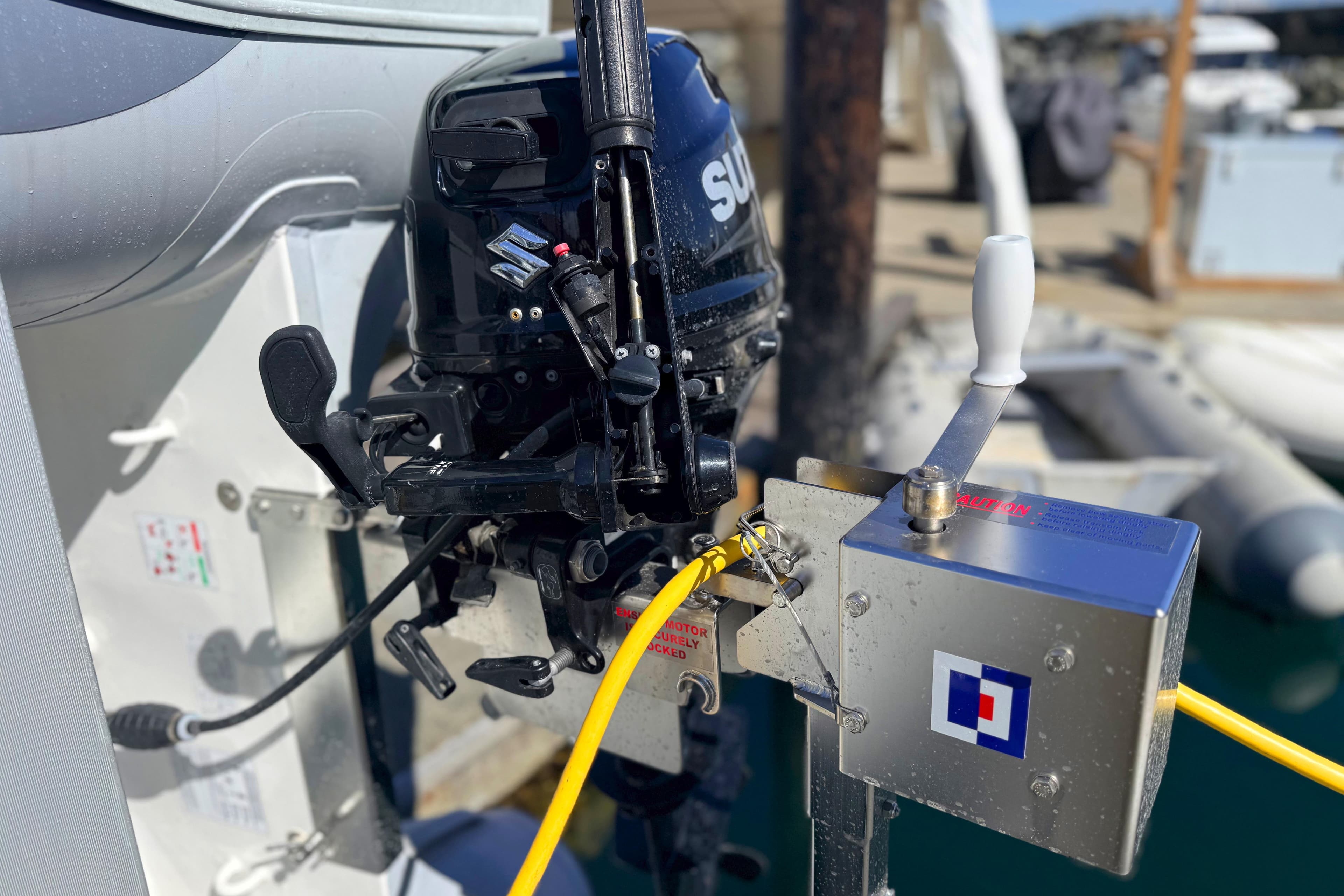 Outboard motor on a Tiara 3700 Open Hardtop, 1996 model, docked at a marina.