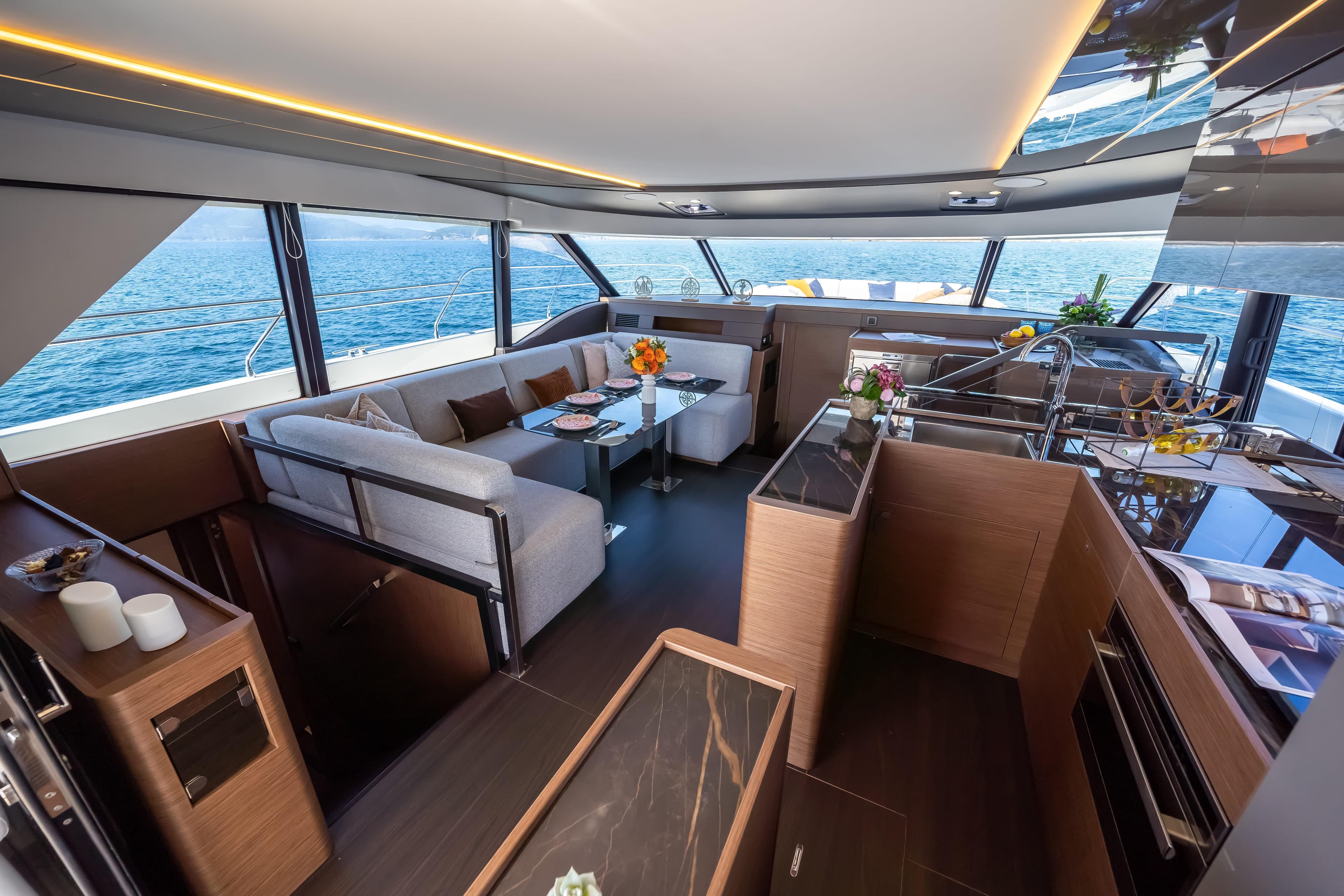 Luxurious interior of 2025 Prestige M48 yacht with modern furnishings and ocean view.