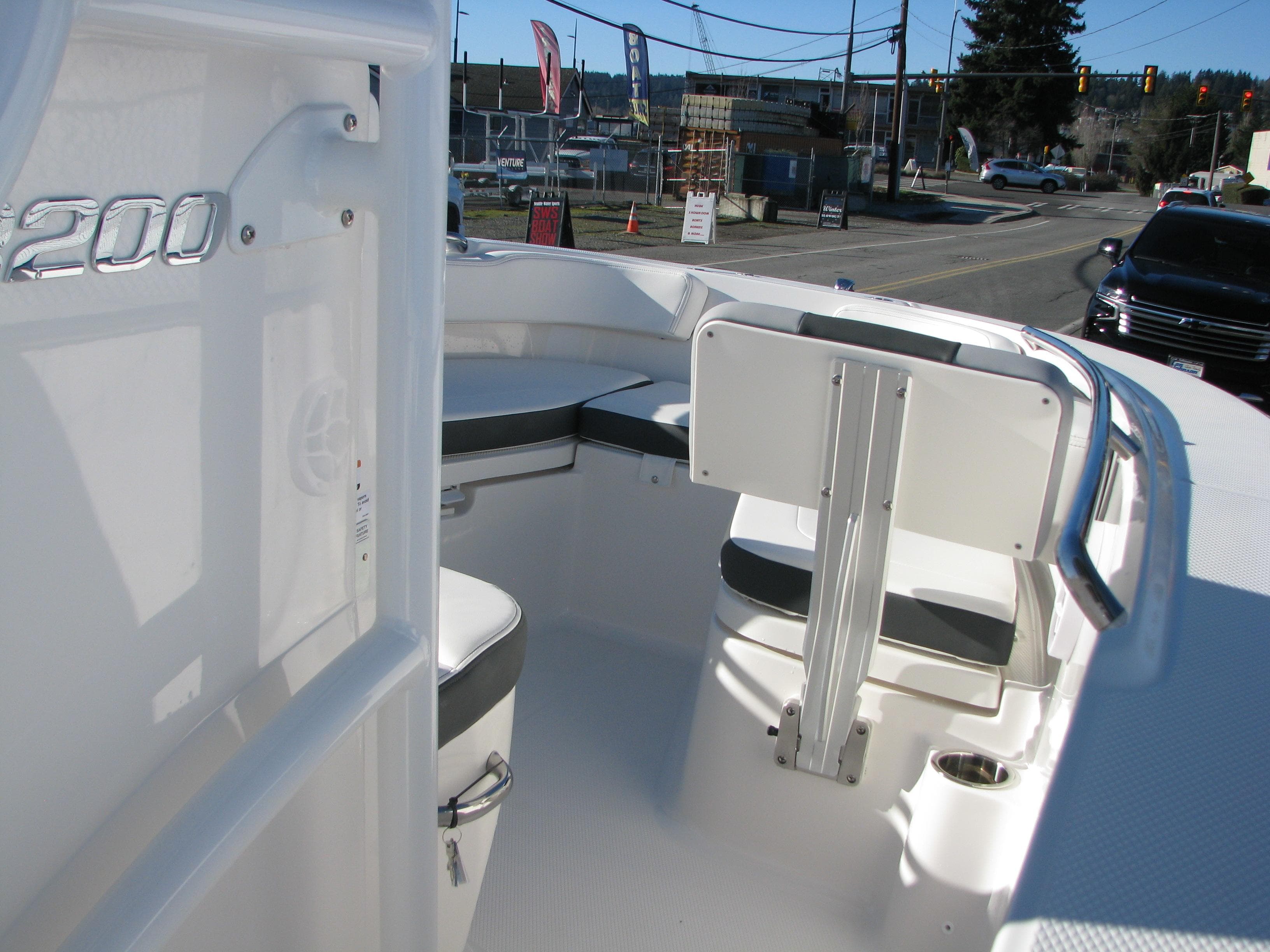 2025 Robalo R200 Center Console boat interior with seating and console view.
