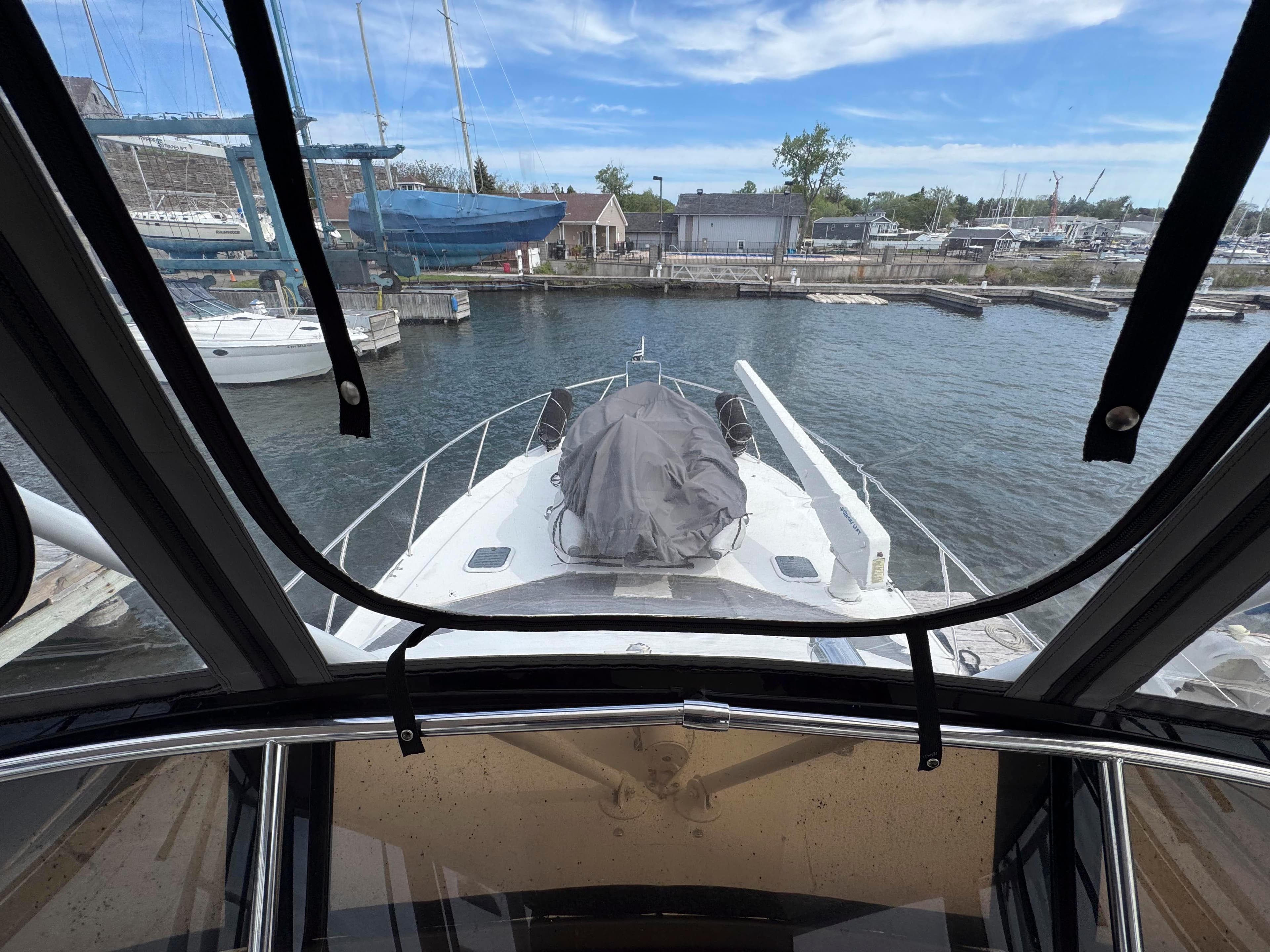 1997 Silverton 41 Convertible yacht docked at marina, view from cabin.