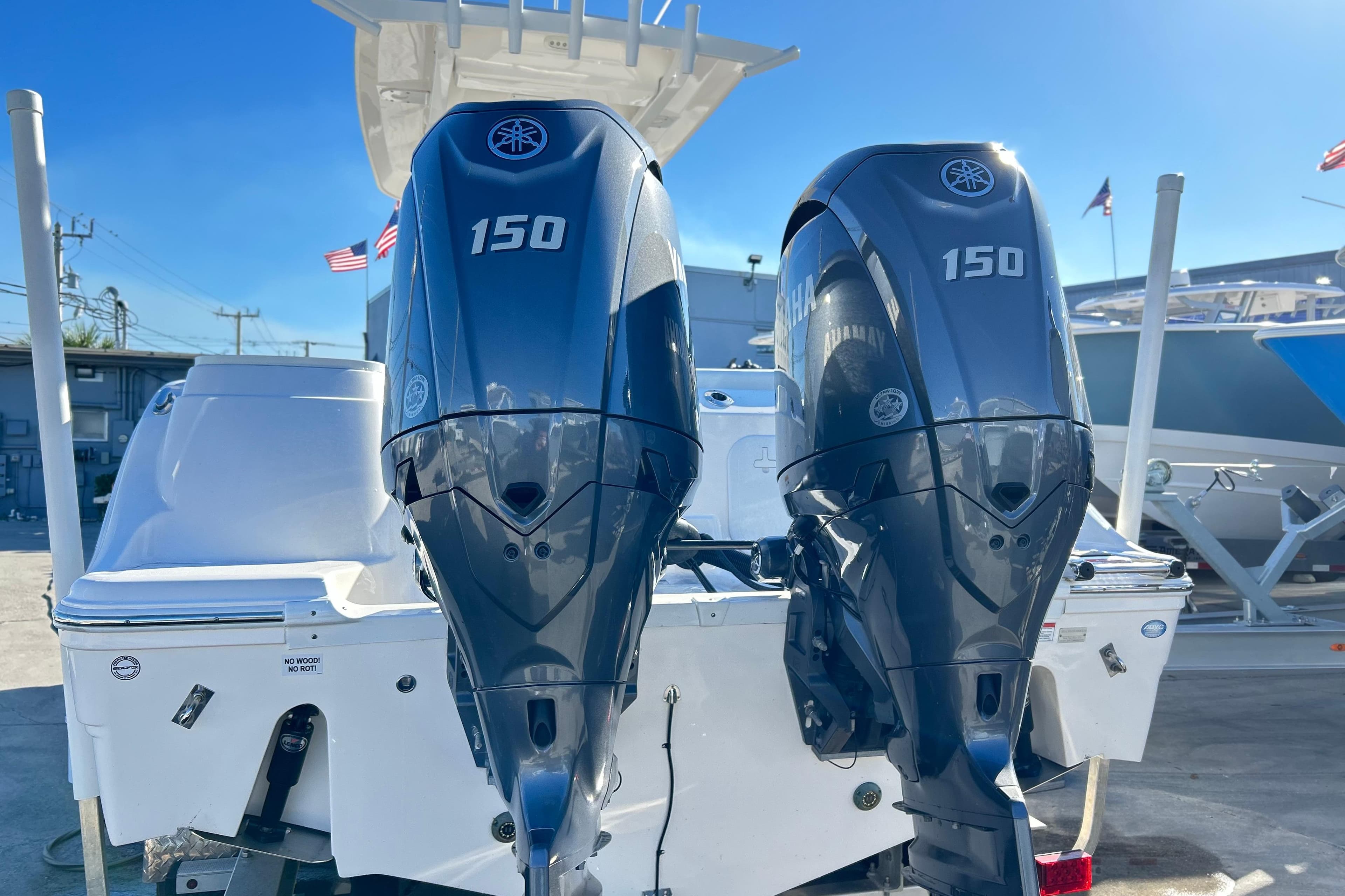 2024 Sea Fox 268 Commander with dual Yamaha 150 outboard engines, docked under clear skies.